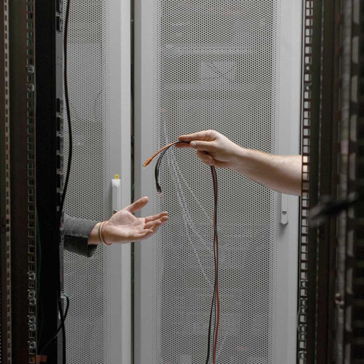 Fiber optic cables are fitted to a server, replacing slower copper cabling. Copper is still prevalent in many data centers but fiber optic cable (thin strands of silica glass) replaces copper where greater bandwidth is needed.