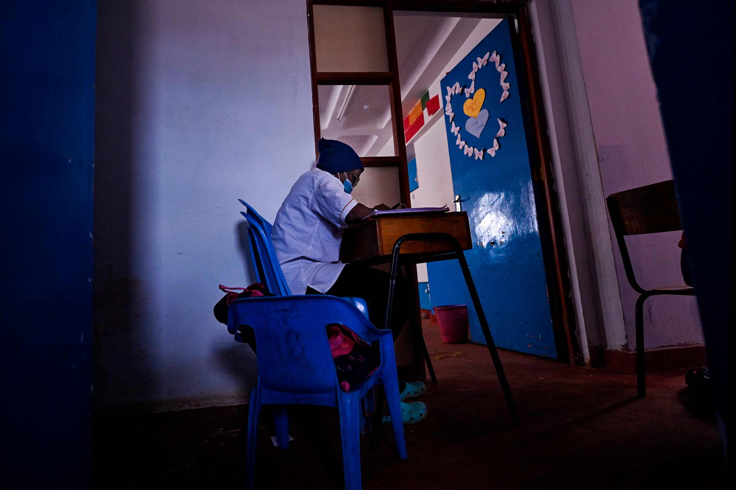 A student sits at her desk at Kibera School for Girls in Kibera, Nairobi, kenya, on Aug. 7, 2020.