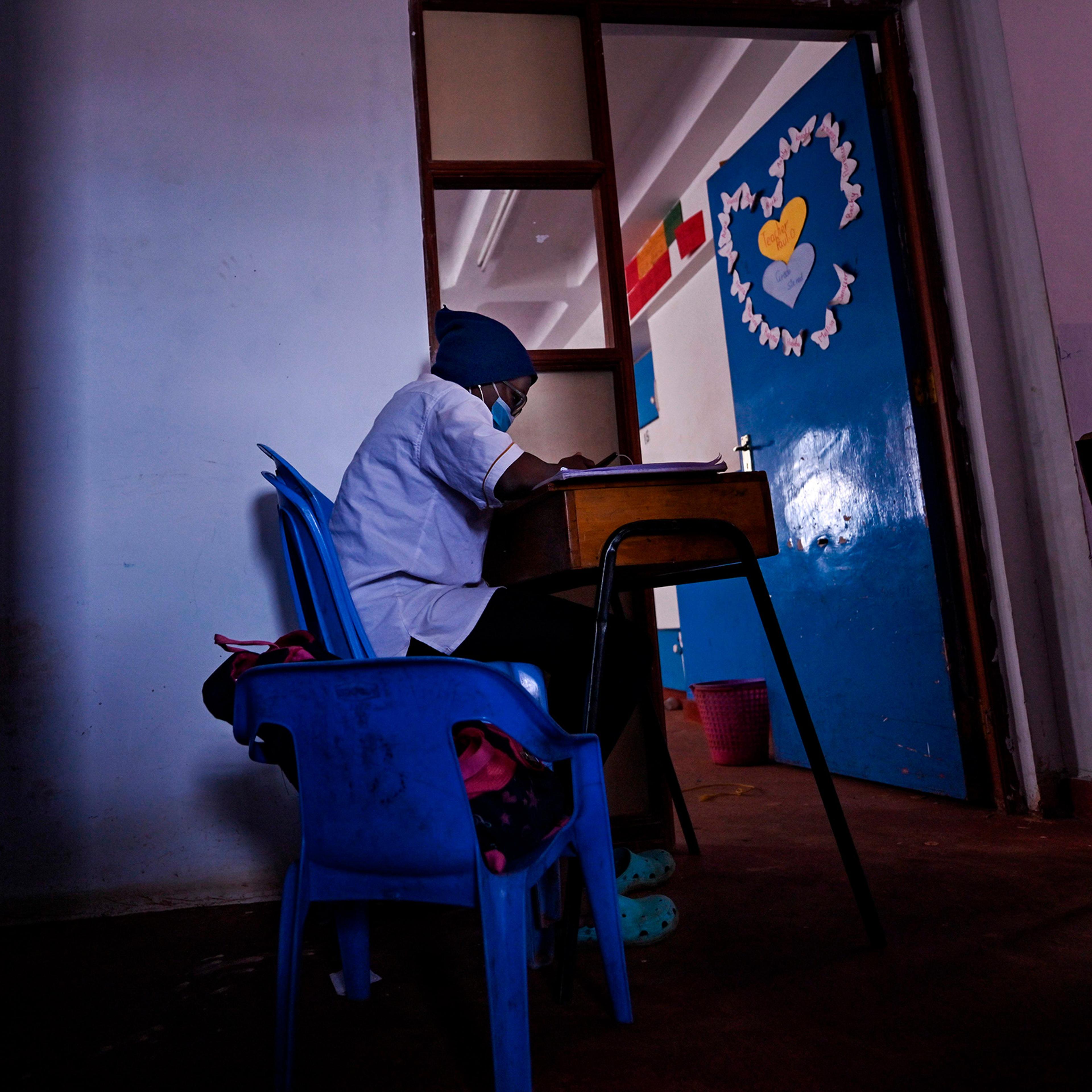 A student sits at her desk at Kibera School for Girls in Kibera, Nairobi, kenya, on Aug. 7, 2020.