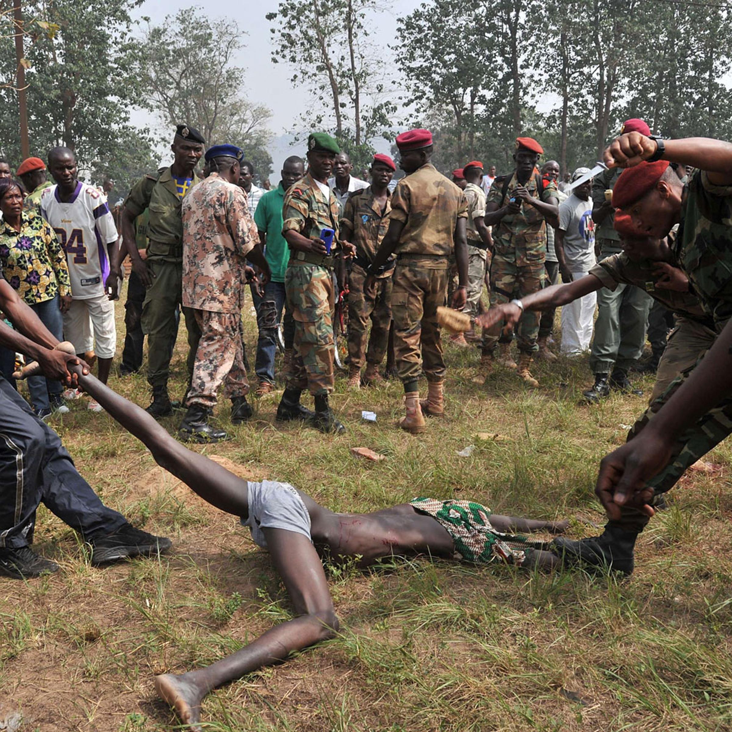 Members of the Central African Armed Forces lynch a man suspected of being a former Seleka rebel on Feb. 5, 2014, in Bangui.