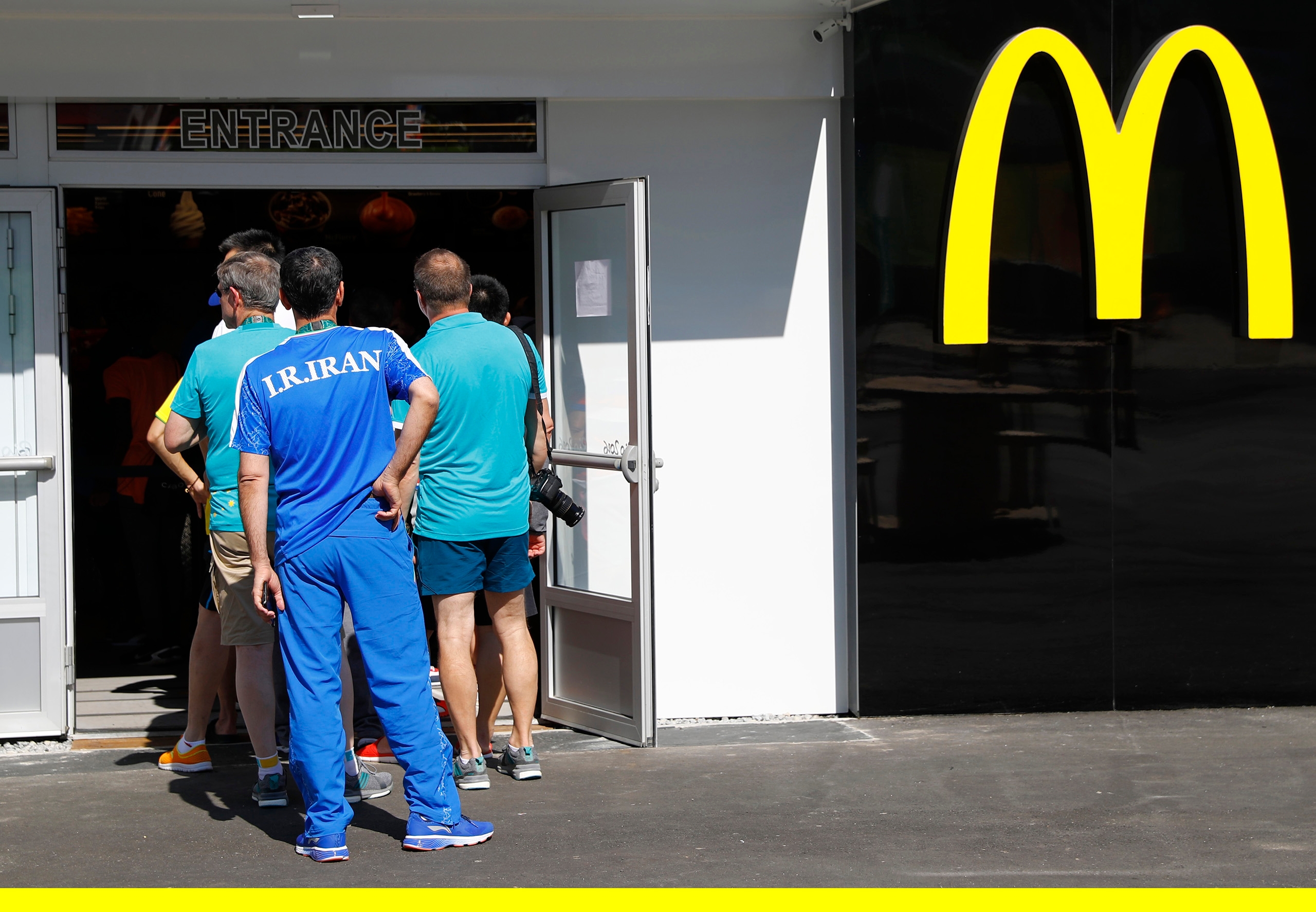 An Iranian athlete lines up at a McDonald's place inside the Olympic village in Rio de Janeiro, Brazil, on Aug. 1, 2016.