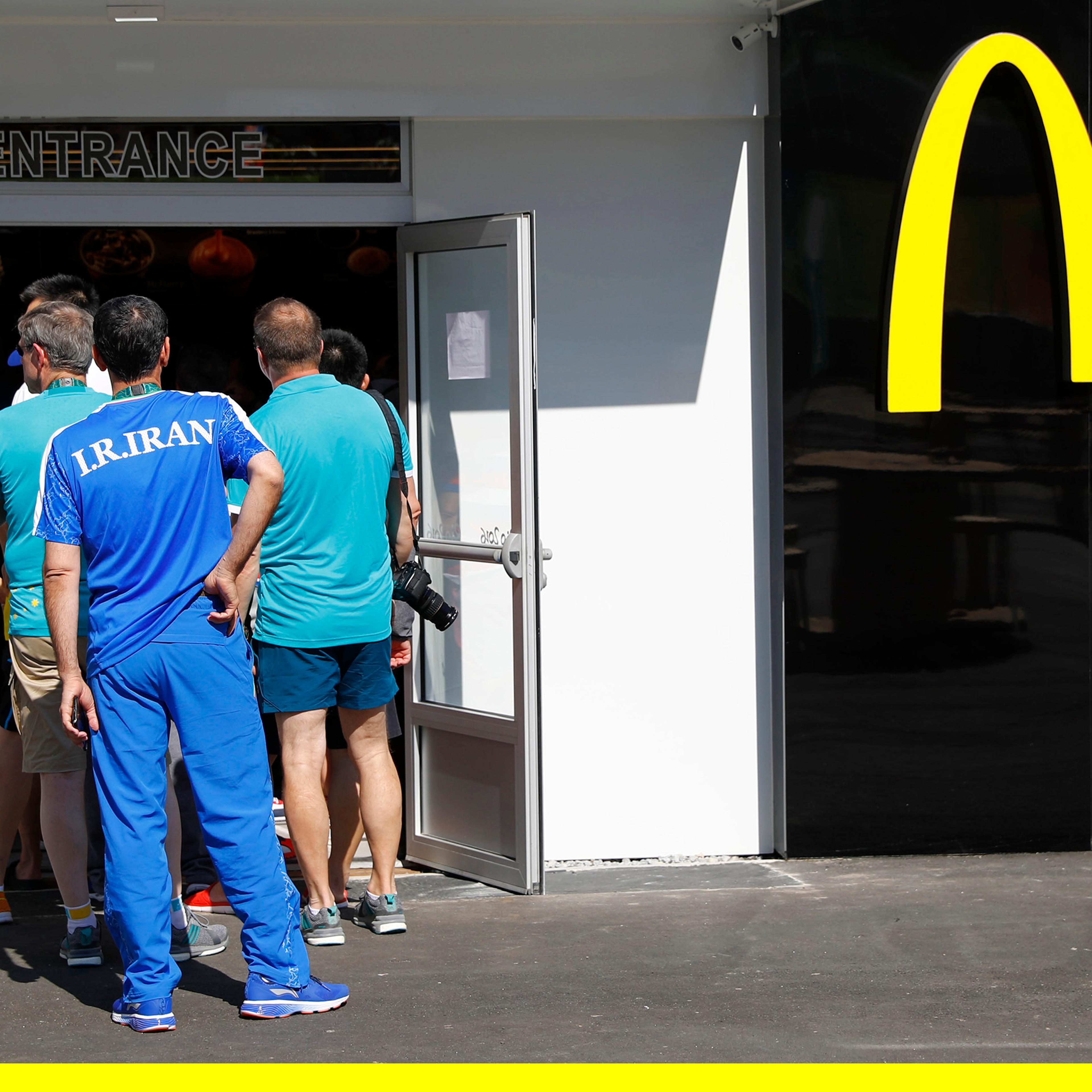 An Iranian athlete lines up at a McDonald's place inside the Olympic village in Rio de Janeiro, Brazil, on Aug. 1, 2016.