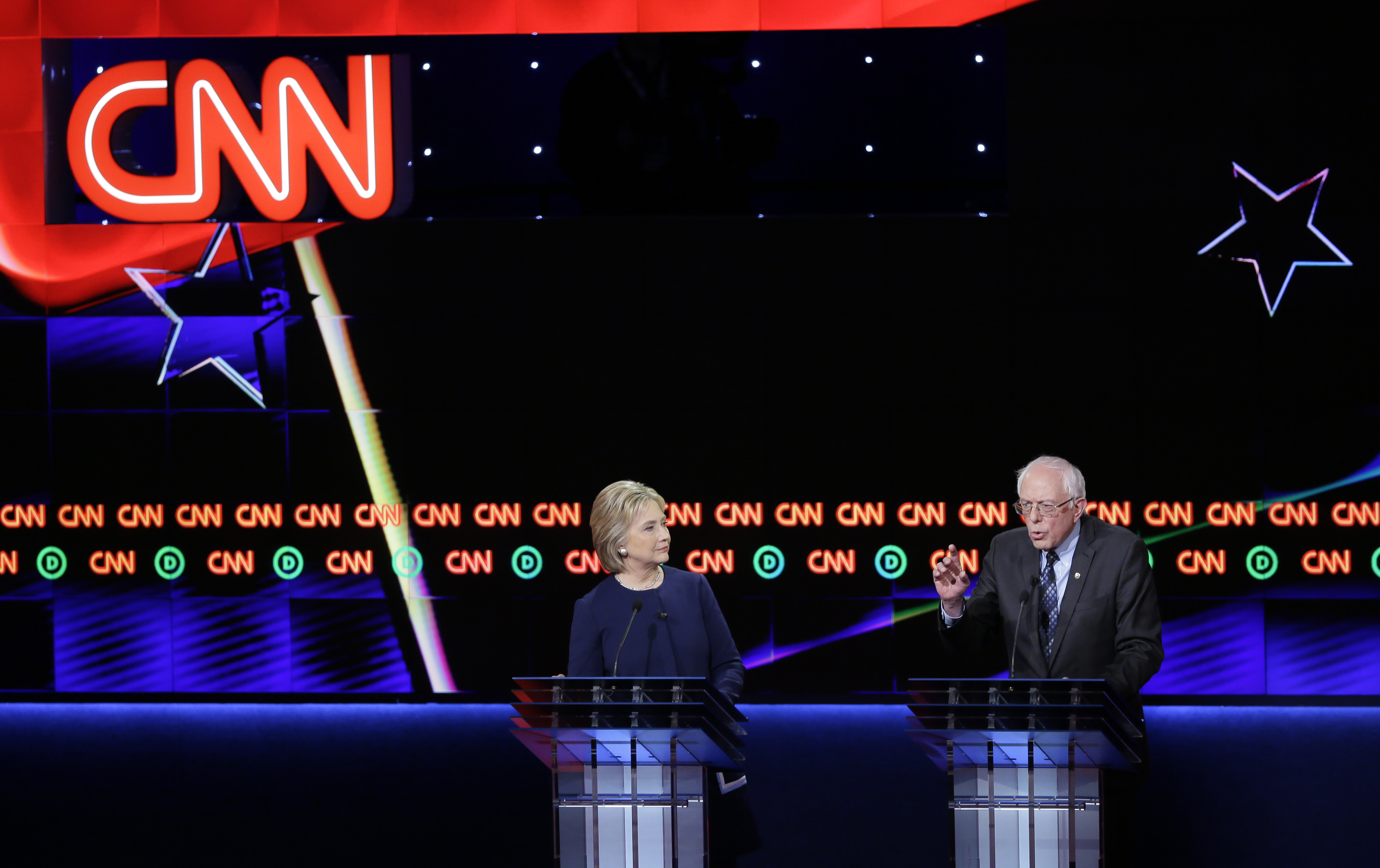 Democratic presidential candidate, Sen. Bernie Sanders argues a point as Hillary Clinton listens during a Democratic presidential primary debate at the University of Michigan-Flint in Flint, Mich. on March 6, 2016, in Flint, Mich.