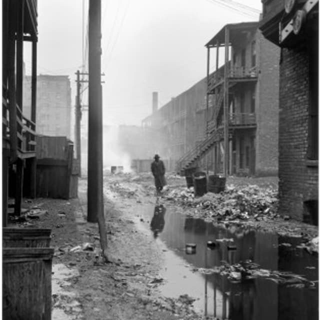 USA. Illinois. Chicago. 1948. An alley between overcrowded tenements, with garbage thrown over the railings of the back porches. Most of the area's tenants were transient. Contact email:New York : photography@magnumphotos.comParis : magnum@magnumphotos.f