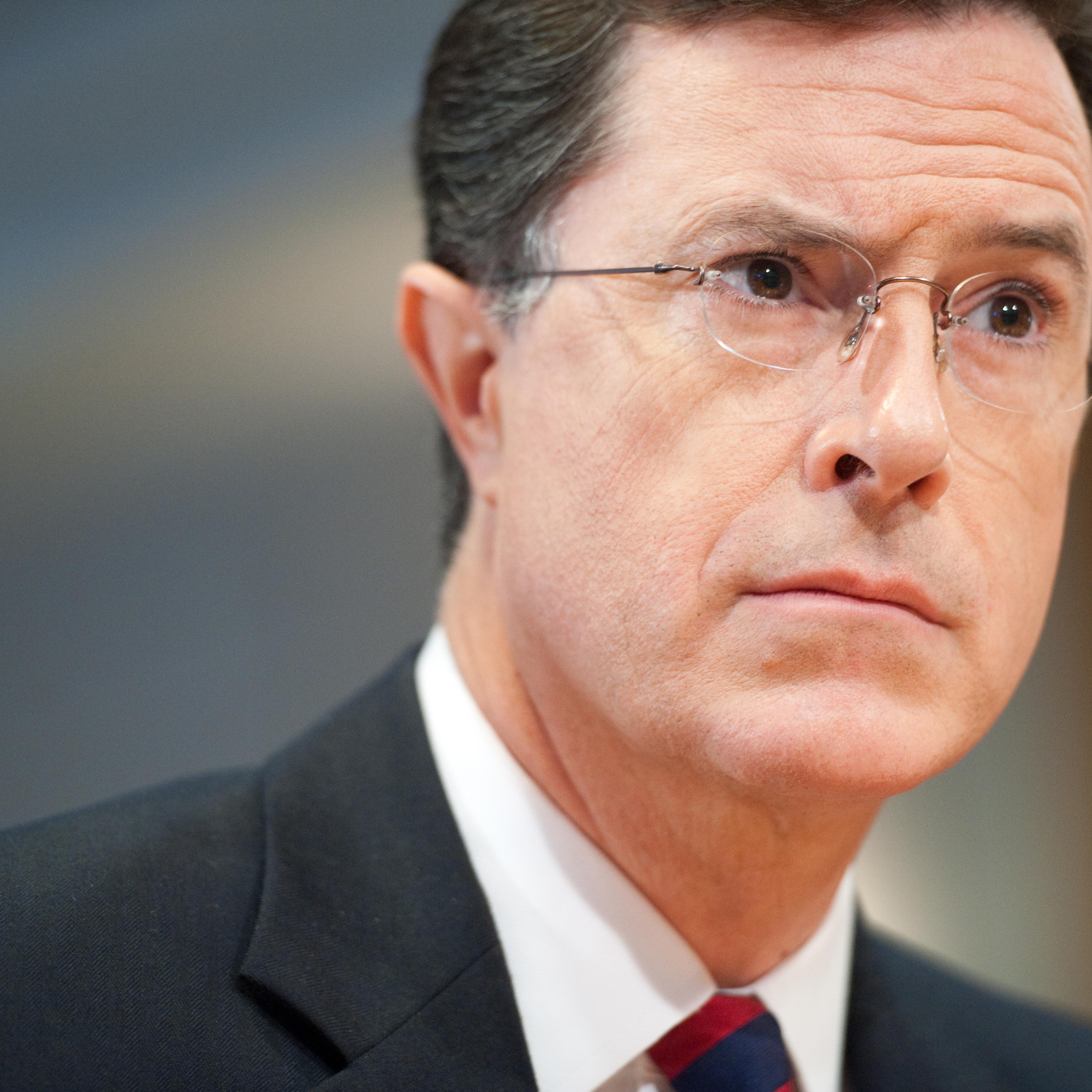 Stephen Colbert listens to a commissioner as he appears at a hearing at the Federal Election Commission in Washington, D.C. to discuss his request to form a Political Action Committee on June 30, 2011.