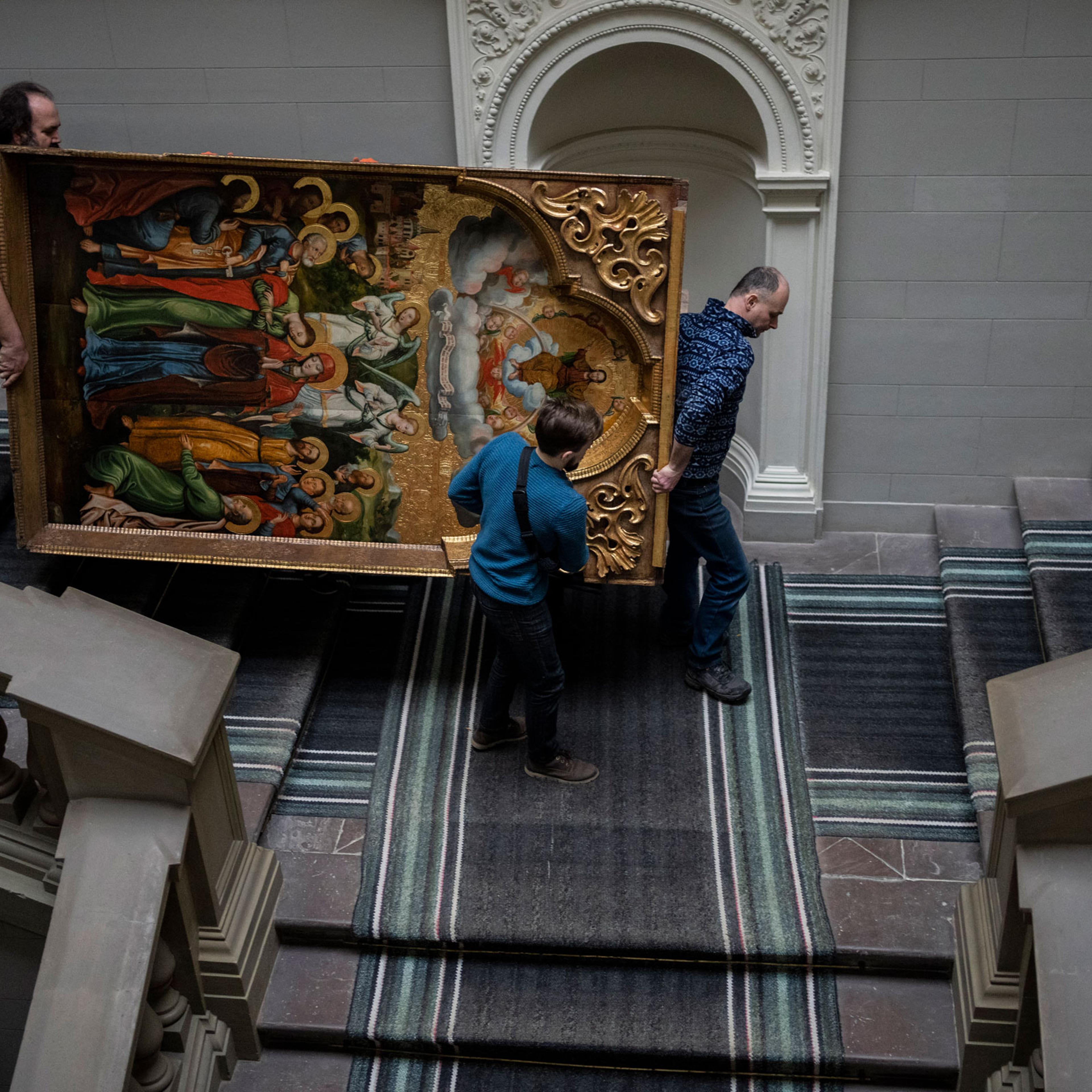 Workers move the Annunciation to the Blessed Virgin of the Bohorodchany Iconostasis in the Andrey Sheptytsky National Museum as part of safety preparations