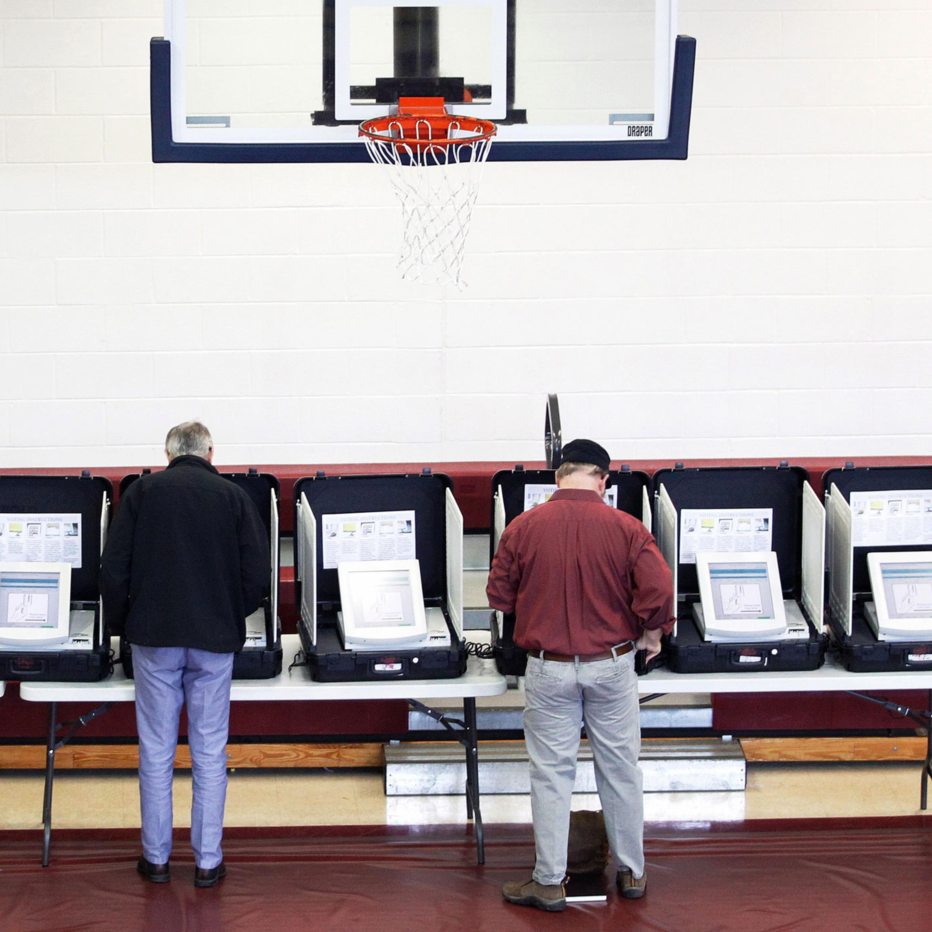 Voters place their ballots in the gymnasium at Saint Philip AME church on Super Tuesday in Atlanta.