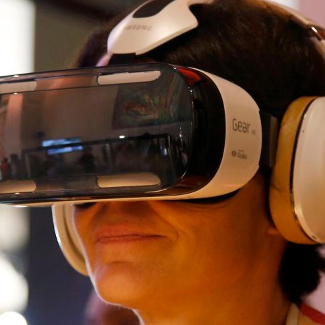 An attendee tries an Oculus-powered Samsung Gear VR headset during the French telecom Orange annual company's innovations show in Paris