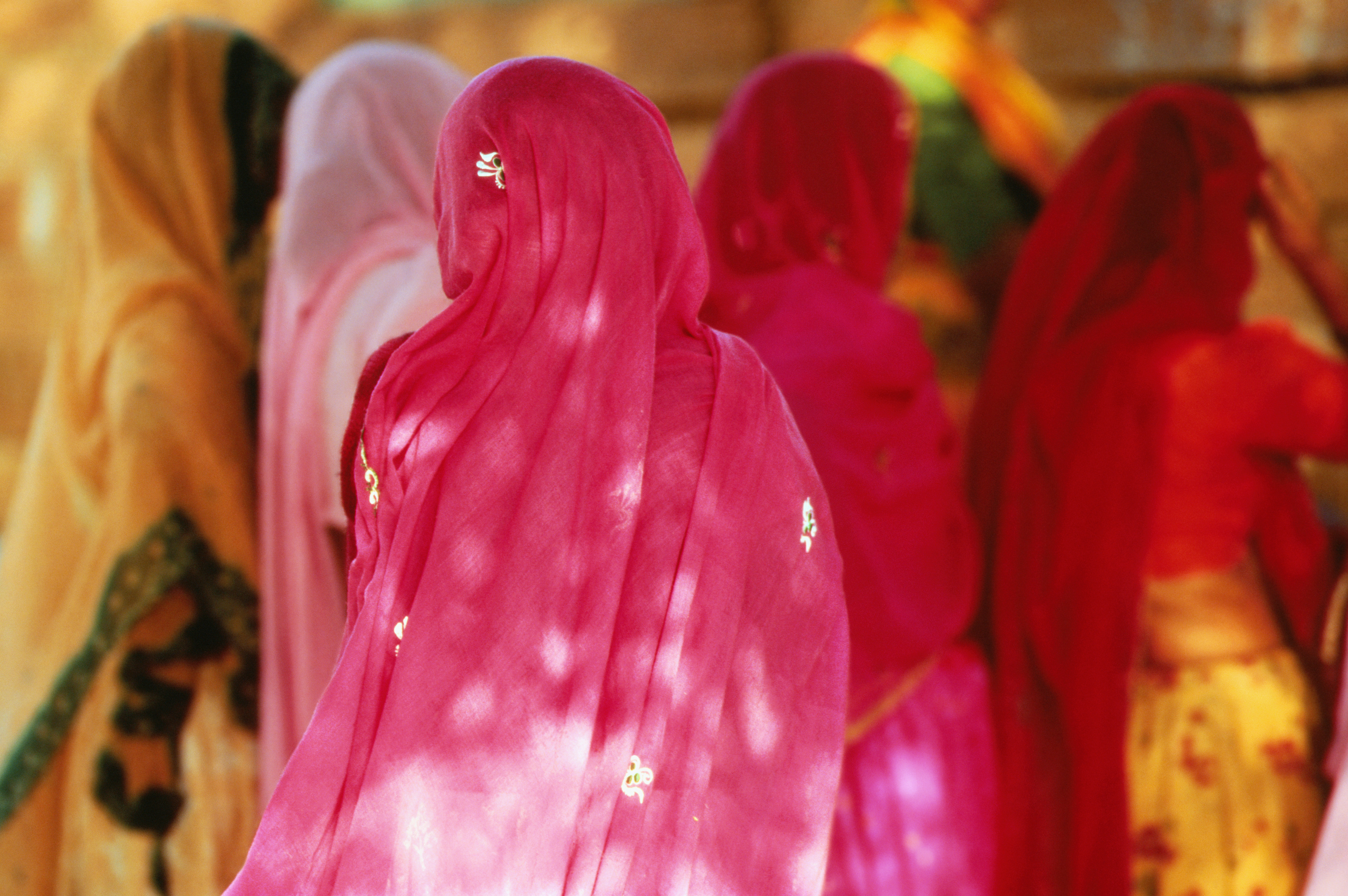 WOMAN IN SARIS, INDIA