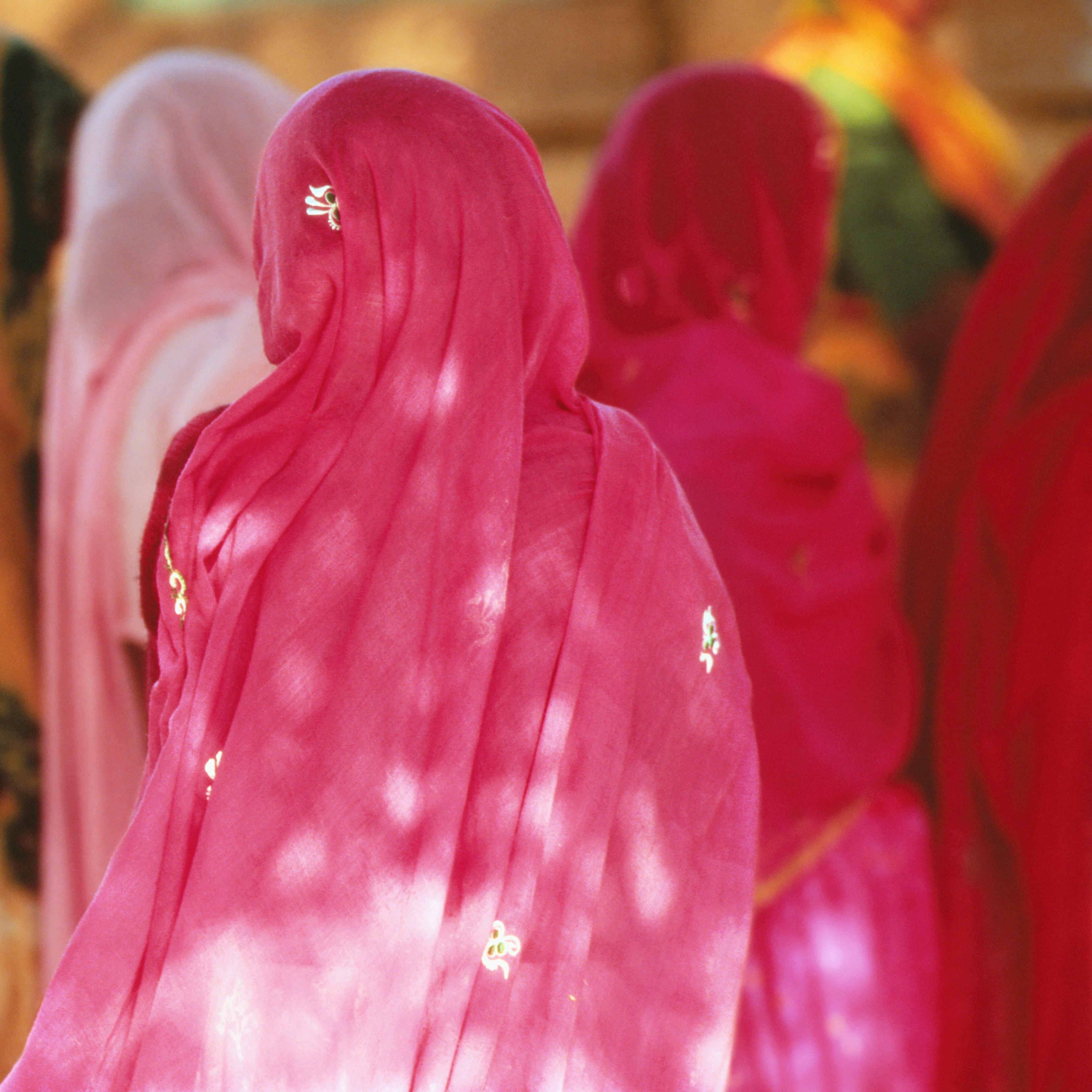 WOMAN IN SARIS, INDIA