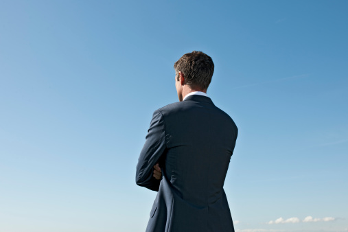 businessman-crossed-arms-rearview