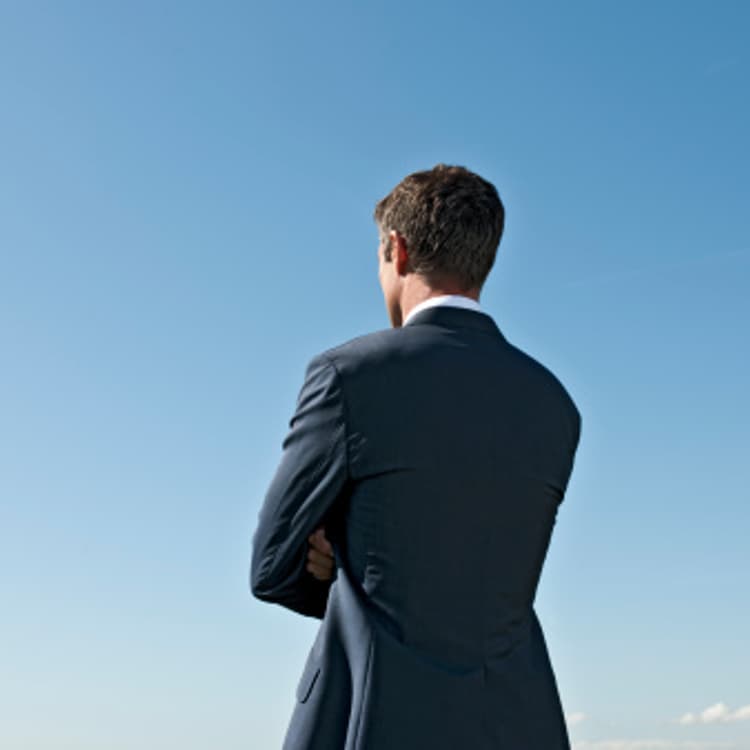 businessman-crossed-arms-rearview