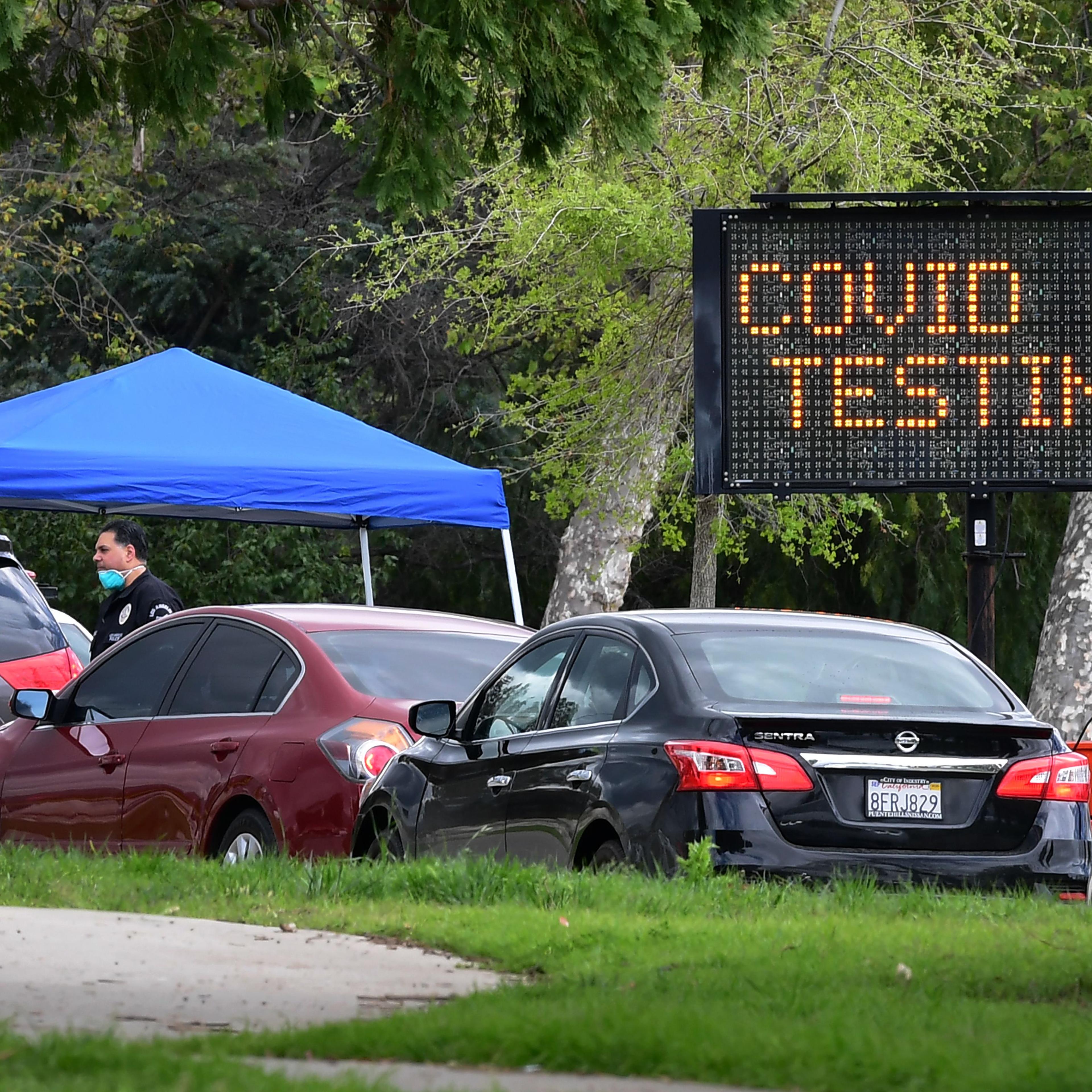 Cars wait at drive-thru Coronavirus testing