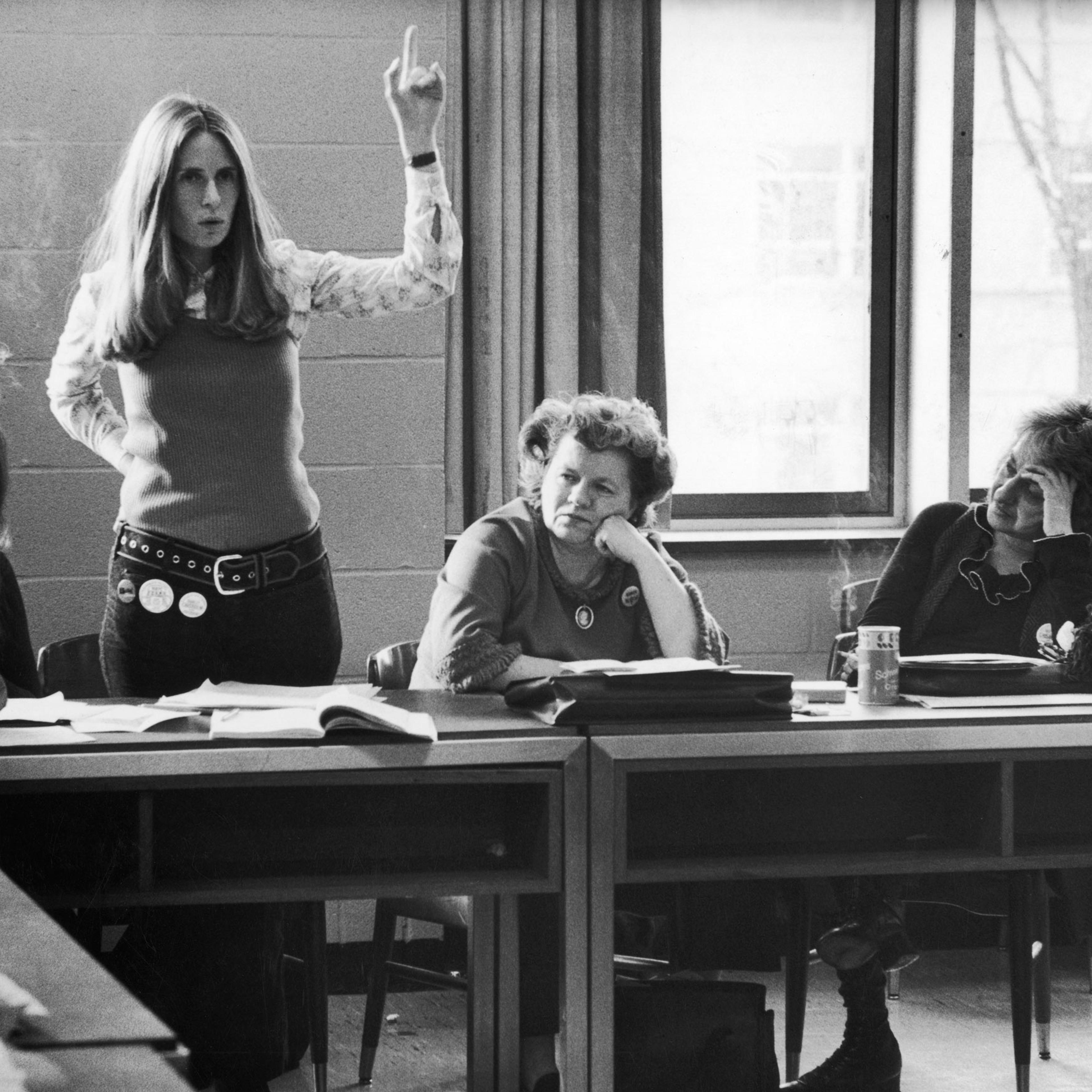 New York lawyer Brenda Feigen Fasteau, arm raised, argues about candidate support at a Washington meeting of the Caucus's National Policy Council. Some fellow members, left to right are: Ms. editor Gloria Steinem, National Organization for Women (NOW) pr