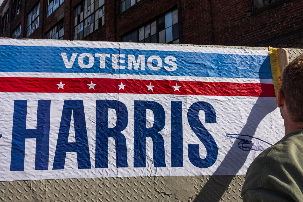 Supporters of Kamala Harris put up posters in Latino neighborhoods in North Philadelphia, Pa. on Oct. 14, 2024.