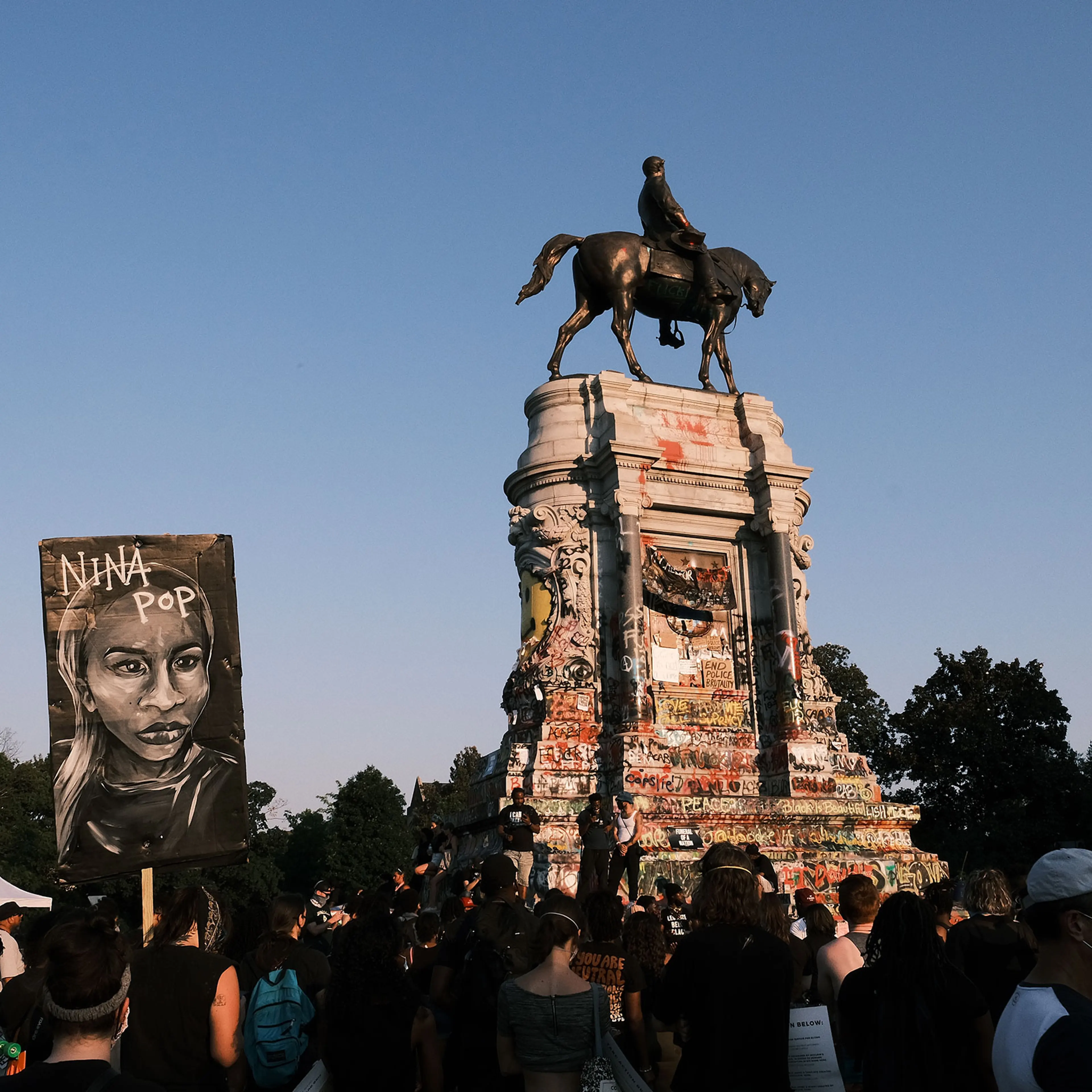 A banner showing the face of Nina Pop at the Lee statue during Black Women Matter "Say Her Name" march on July 3, 2020 in Richmond, Virginia.