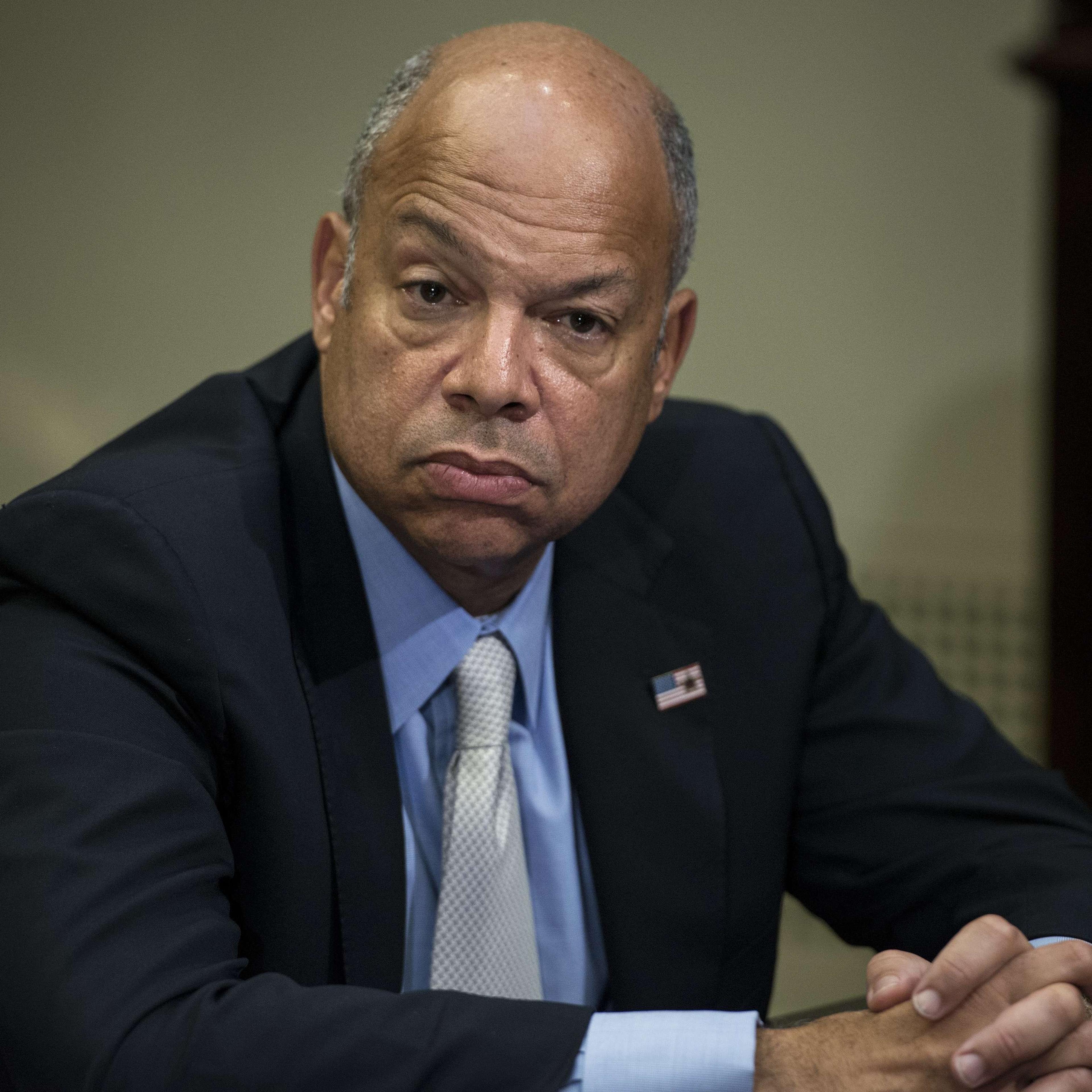 US Secretary of Homeland Security Jeh Johnson listens while US President Barack Obama makes a statement to the press after a meeting in the Roosevelt Room of the White House on Oct. 6, 2014 in Washington, DC.