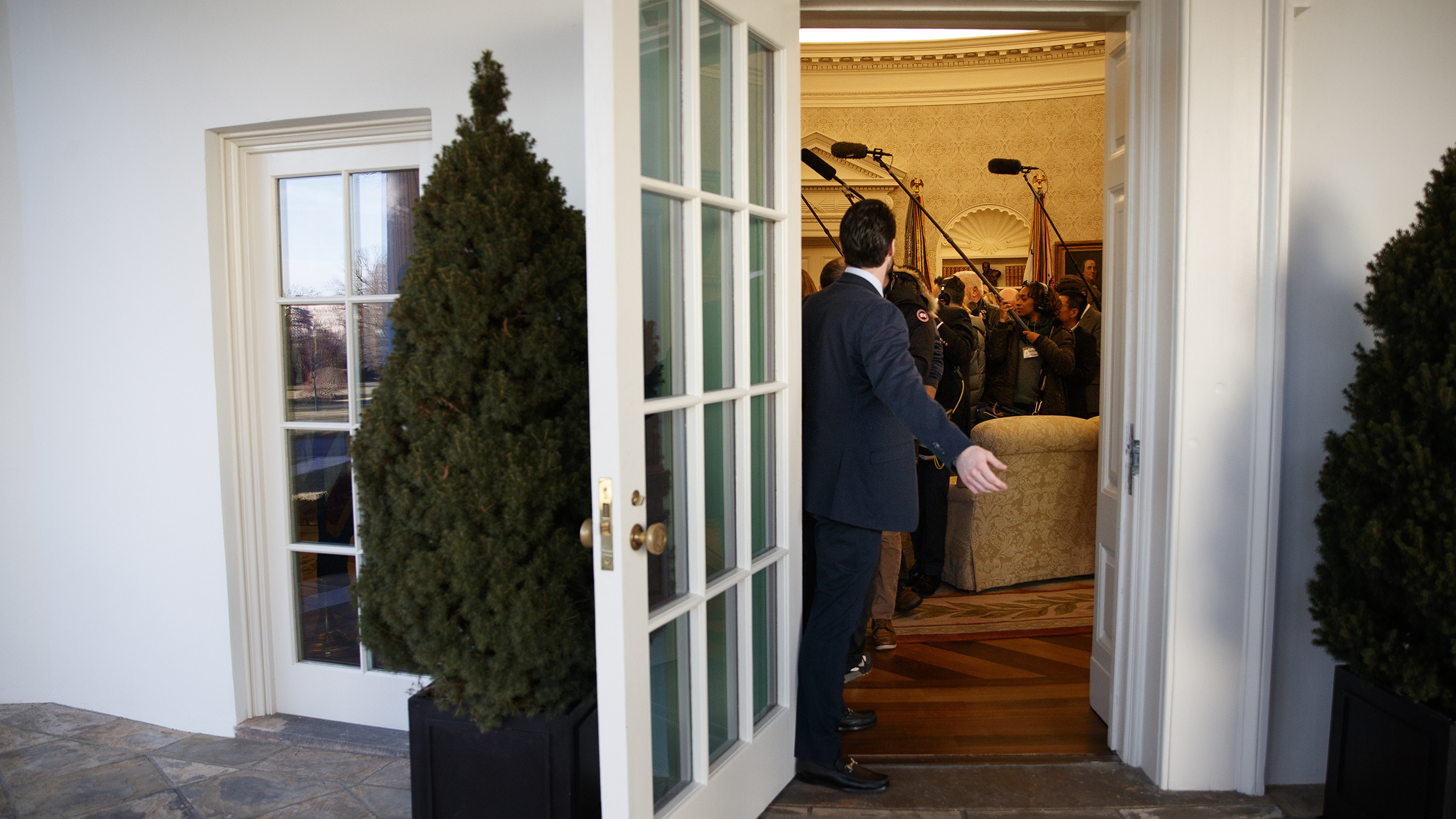 Members of the press in the Oval Office