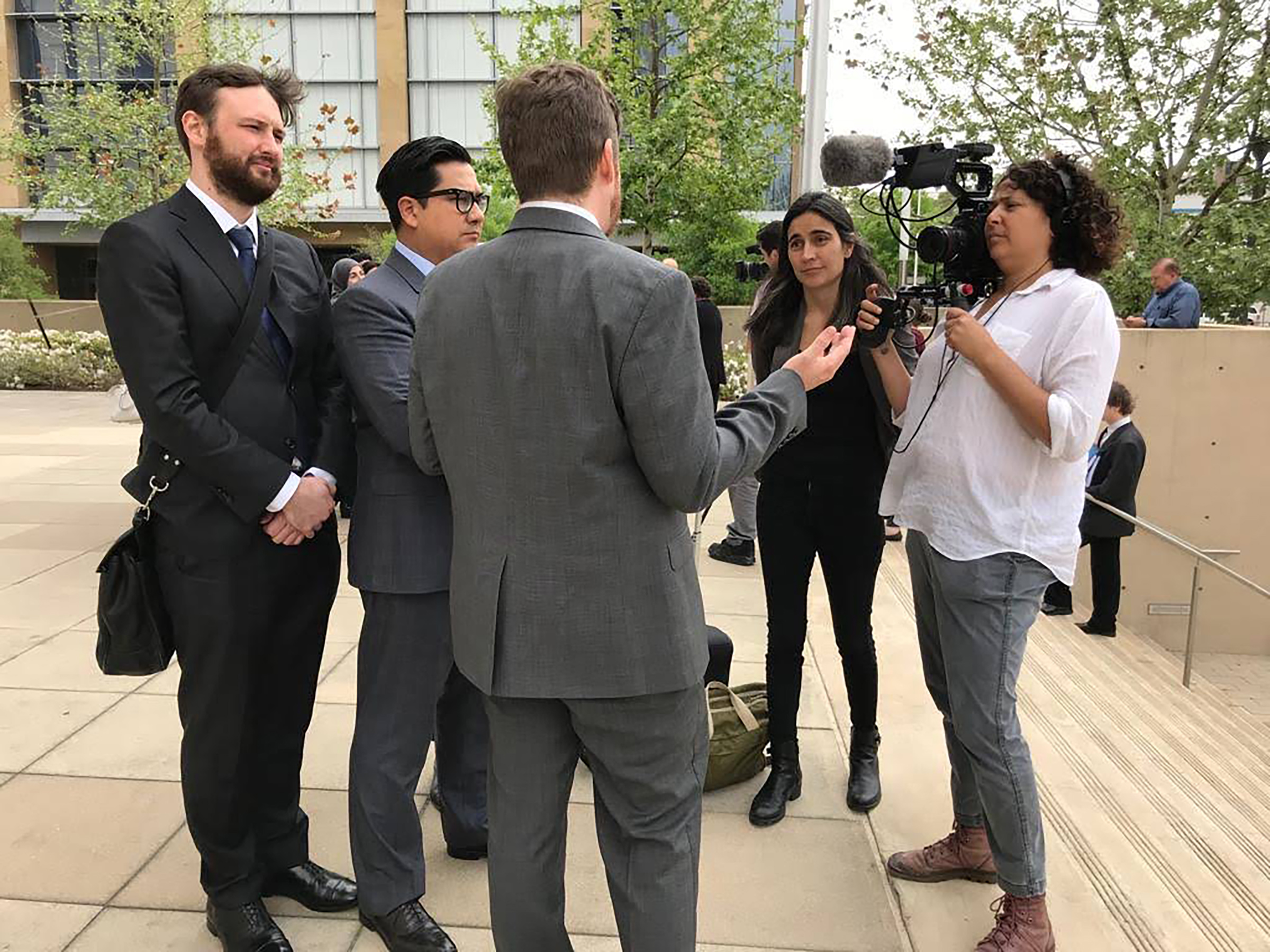 Julia Bacha and cinematographer Amber Fares interviewing ACLU lawyers outside the courtroom in Austin, Texas