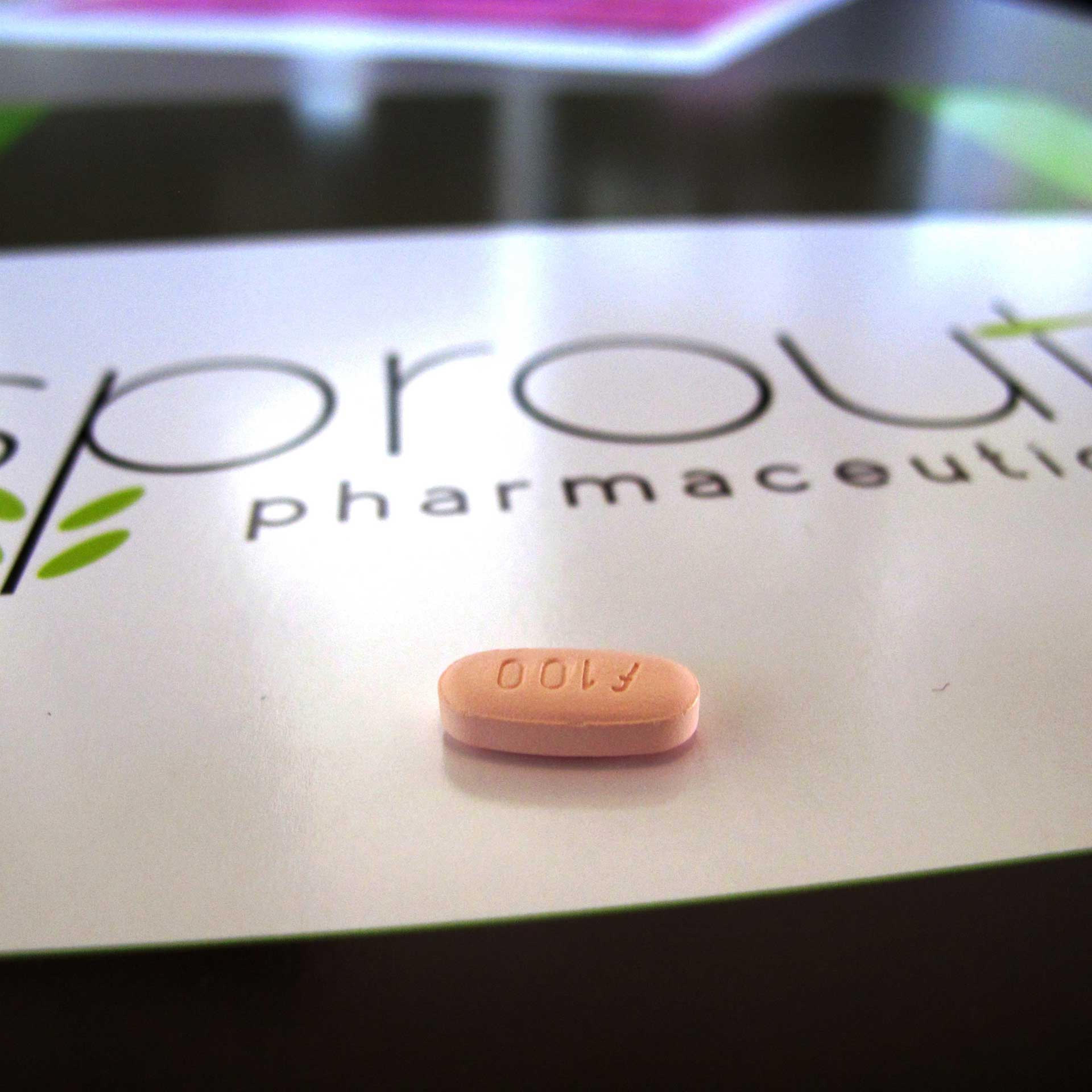 A tablet of flibanserin sits on a brochure for Sprout Pharmaceuticals in the company's Raleigh, N.C., headquarters.
