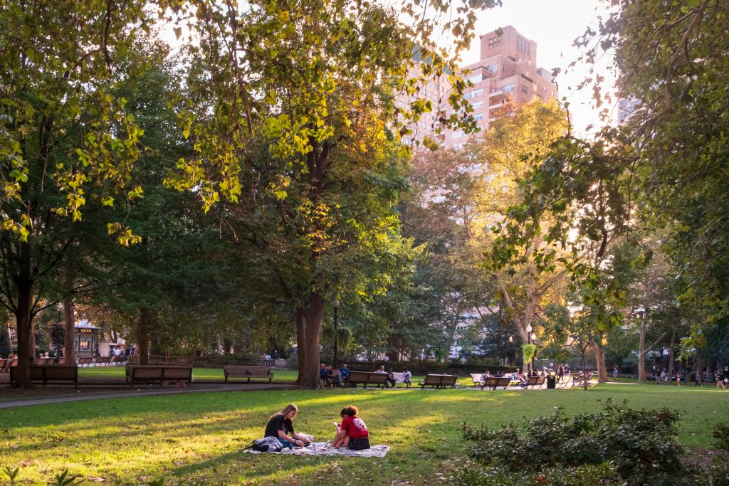 people enjoying a summer afternoon in Rittenhouse Suare, Philadelphia, Pennsylvania, USA