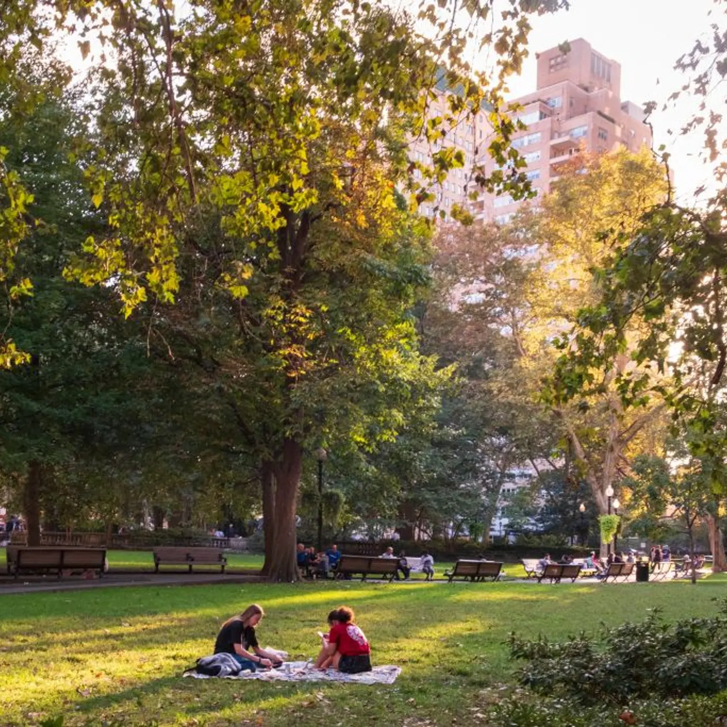 people enjoying a summer afternoon in Rittenhouse Suare, Philadelphia, Pennsylvania, USA