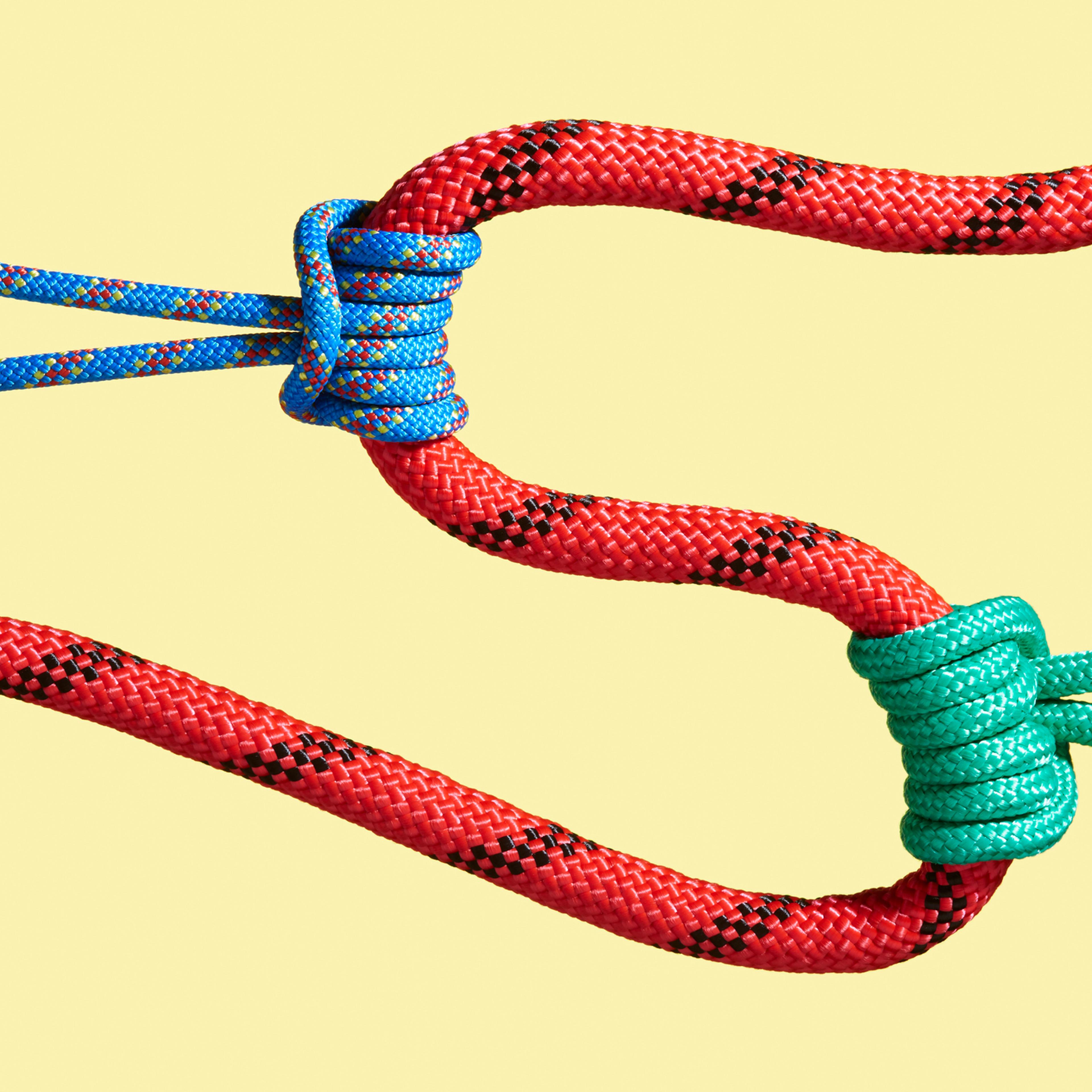 Two ropes pulling on a larger rope to shape its path