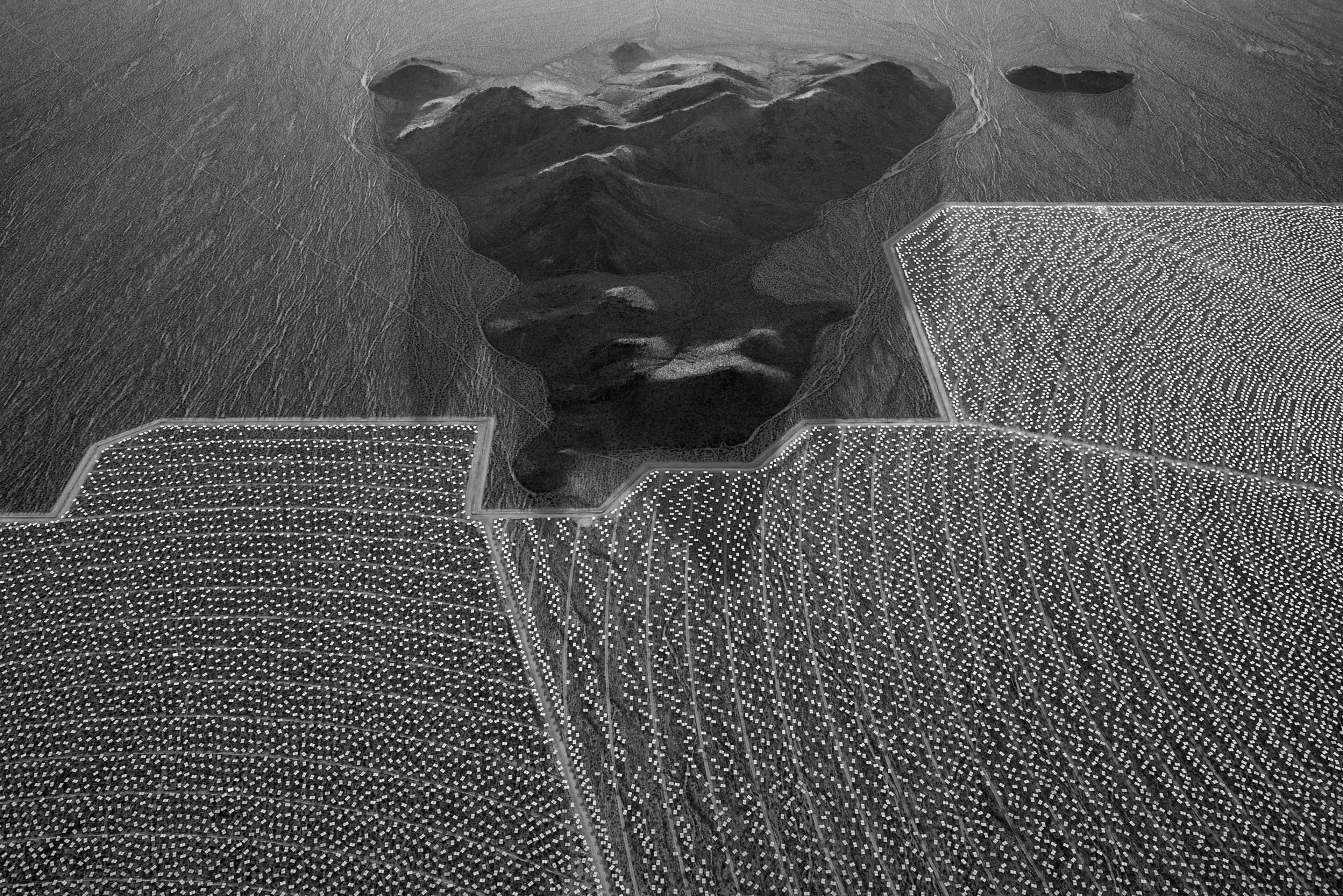 Mirrored heliostats dot the landscape at the Ivanpah Solar Plant in the Mojave Desert, California. Jamey Stillings