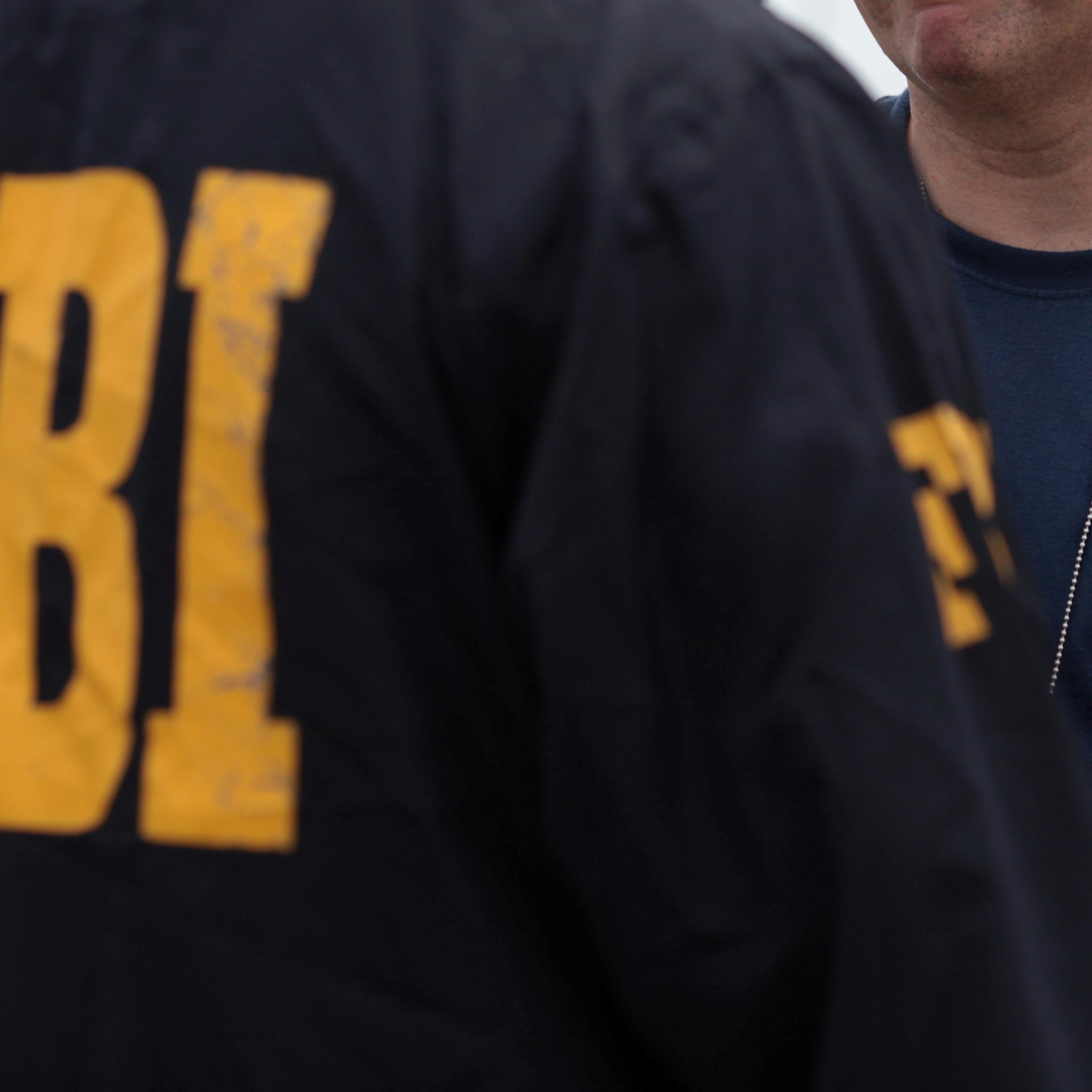Douglas Leff, special agent in charge of the FBI's San Juan division stands outside the offices of the anti-narcotics police division during a raid, in Vega Baja
