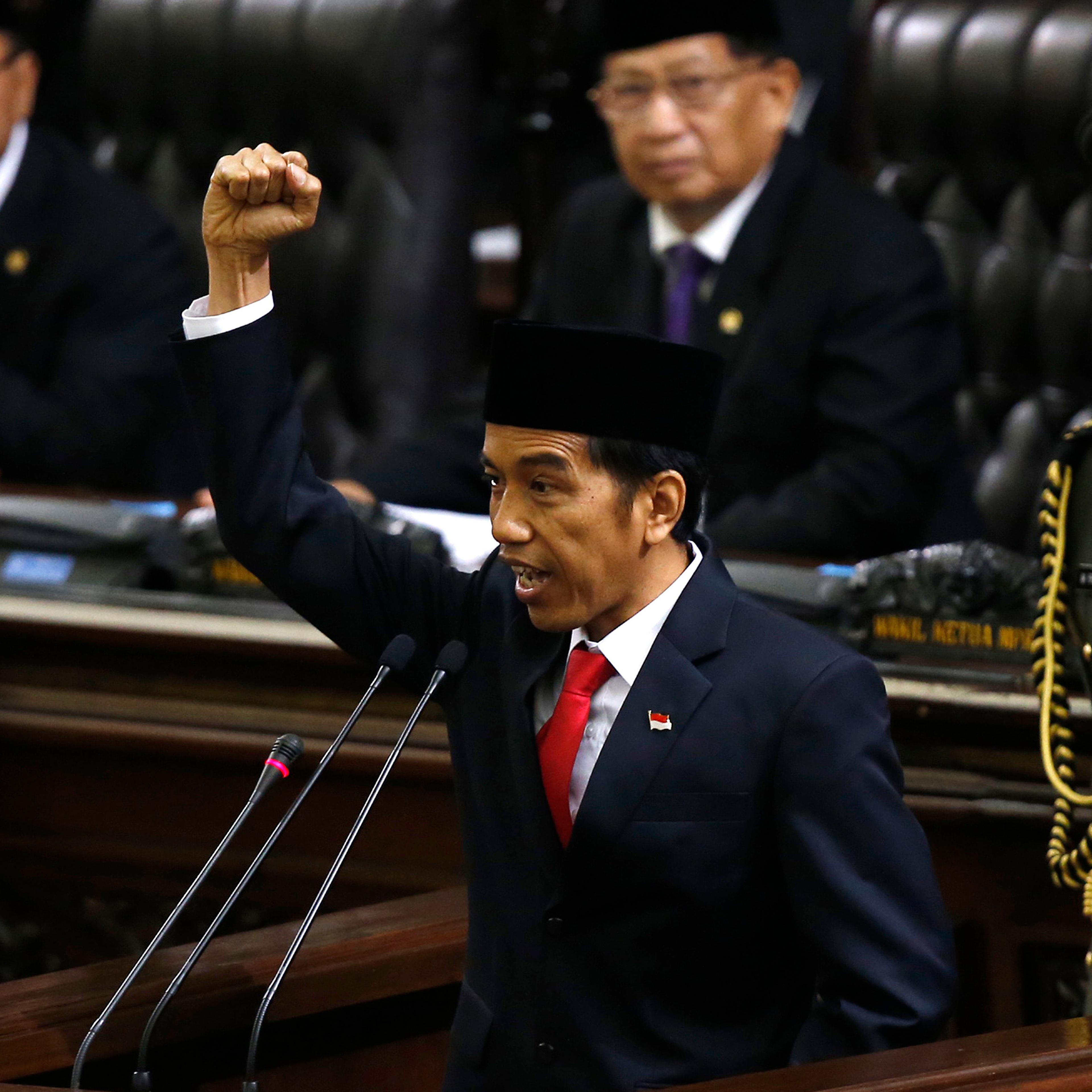 Indonesia's new President Widodo shouts "Merdeka" or Freedom at the end of his speech, during his inauguration in Jakarta