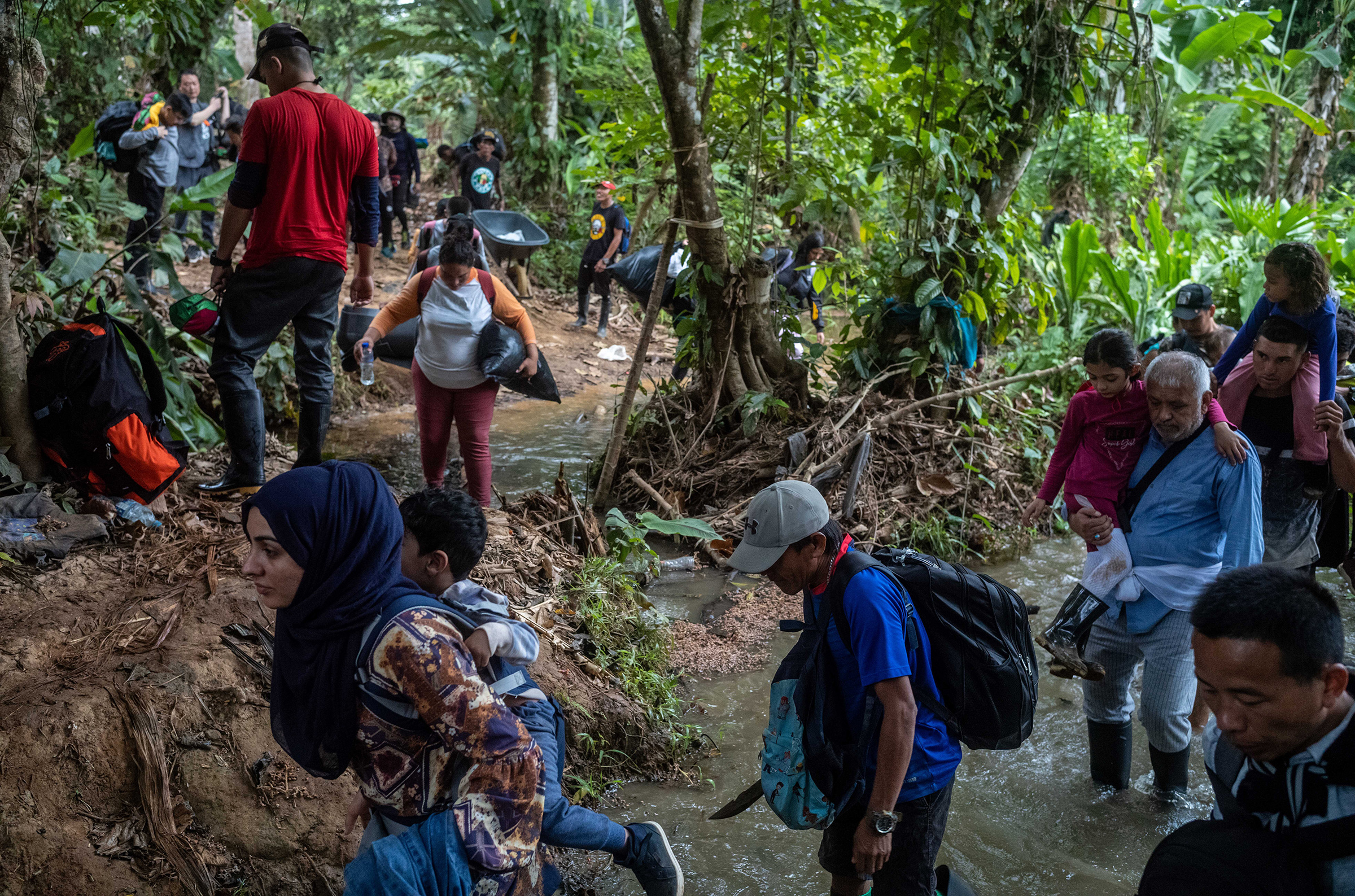 Afghan migrants walking in the jungle crossing the Darien Gap, in Panama, on March 6.