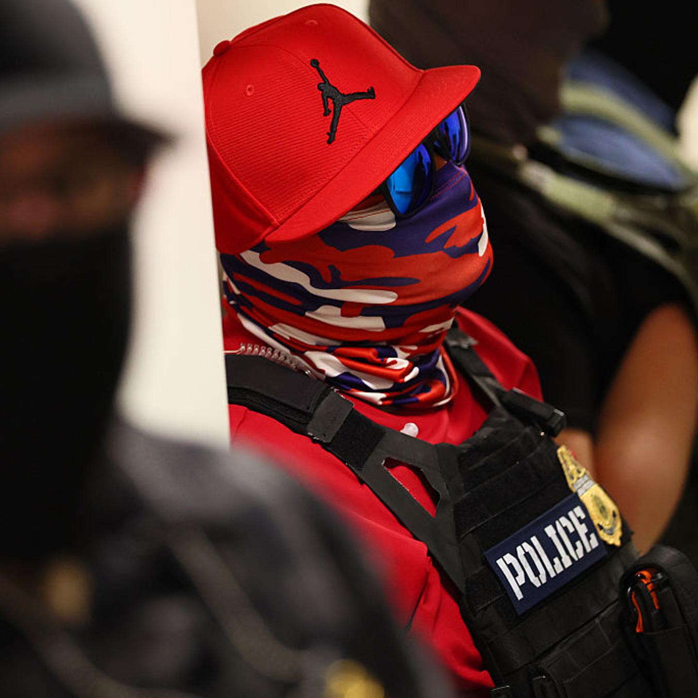 Federal agents wearing masks patrol the halls of immigration court at the Ted Weiss Federal Building in New York City on July 9, 2025.