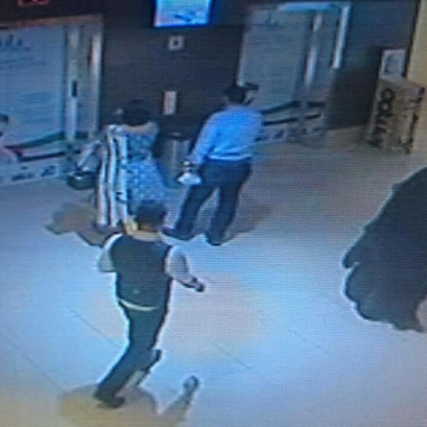A CCTV image shows a fully veiled woman walking in a shopping mall in the Emirati capital, Abu Dhabi. The woman is a suspect in the killing of an American teacher stabbed in the Boutik Mall's toilet.