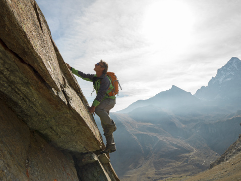 man-climbing-mountain