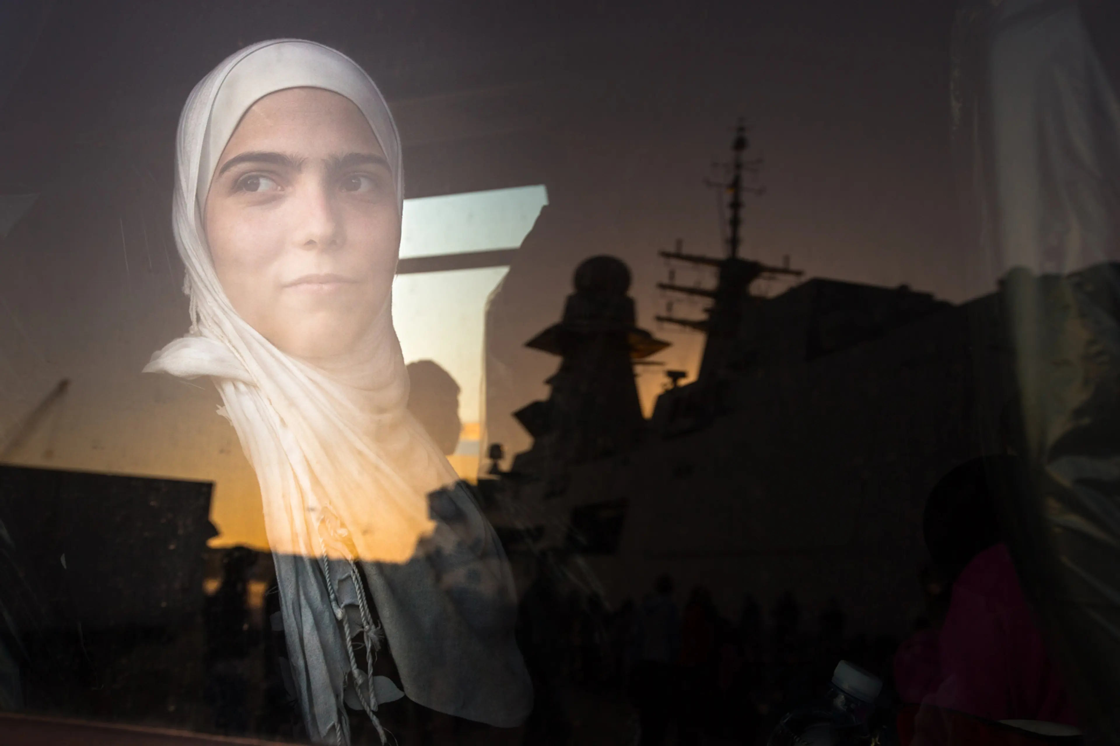 Syrian refugees on an Italian navy ship after being rescued from a fishing vessel carrying 443 Syrian asylum seekers, June 5.