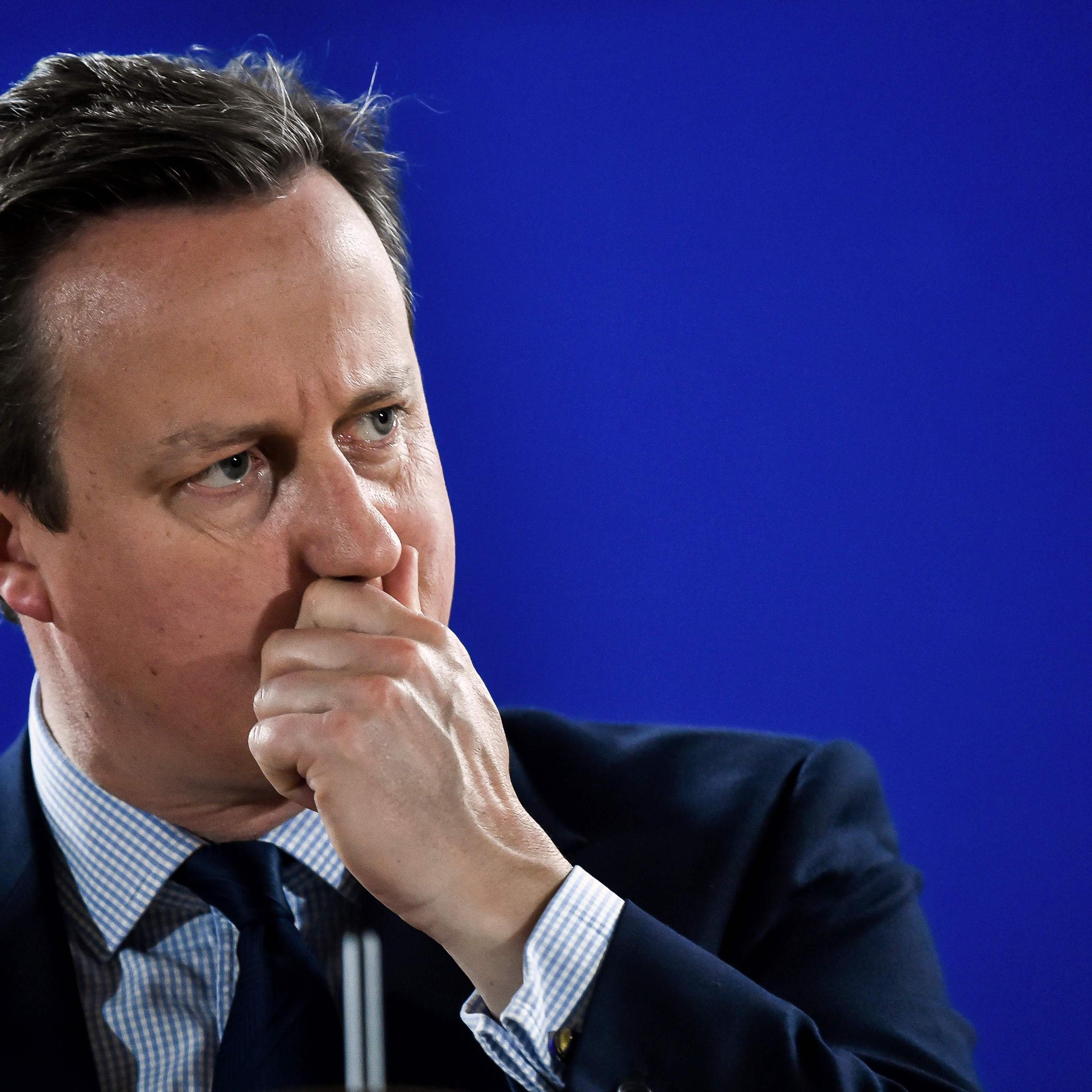 British Prime minister David Cameron gestures as he delivers a speech during a press conference during an European Union summit at the EU headquarters in Brussels on June 28, 2016.