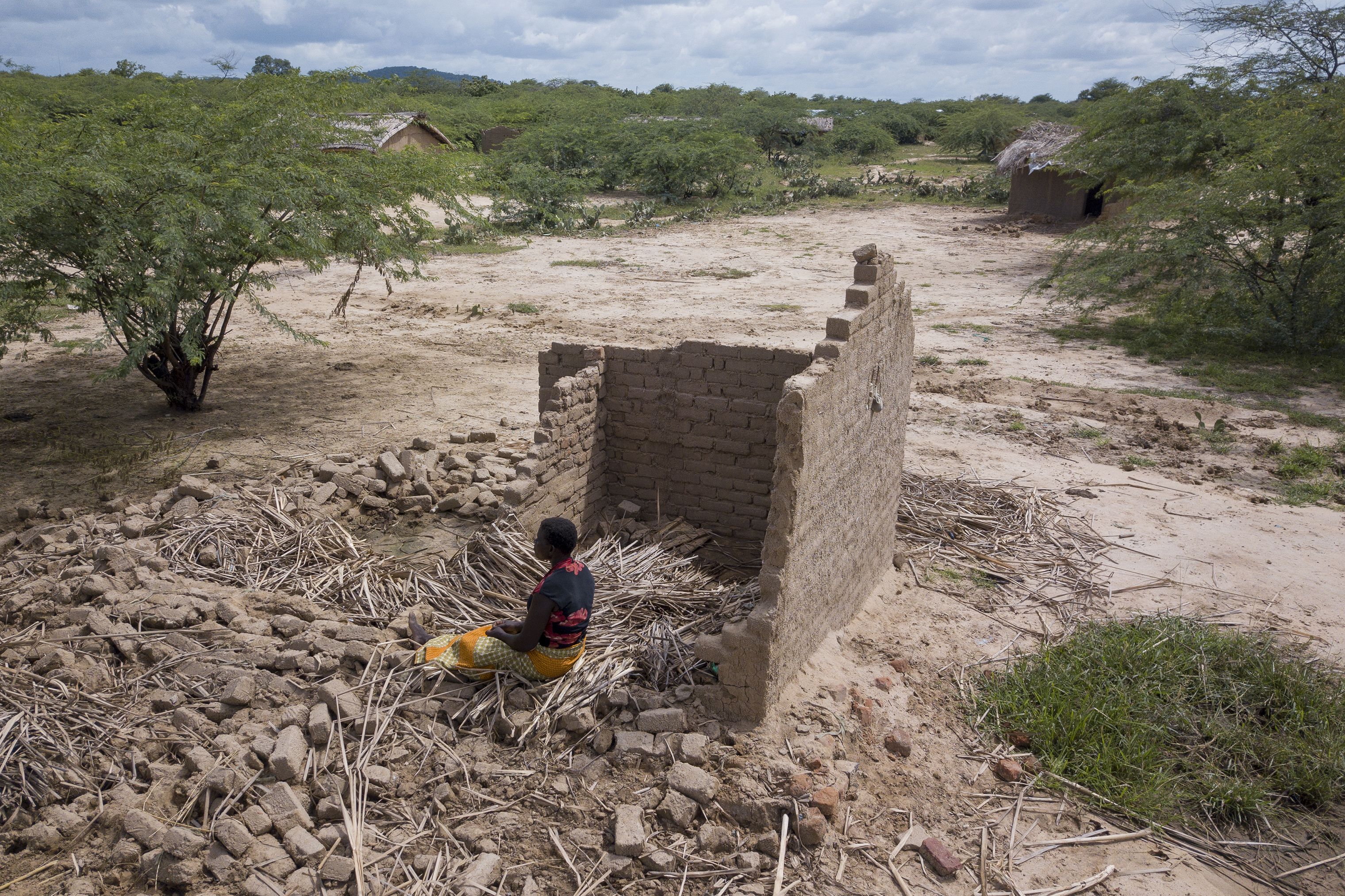 Eliza Jasi has experienced three floods: 2012, 2015, 2019. She has been able to rebuild her home using old bricks after each flood. This time around she will not be able to.
