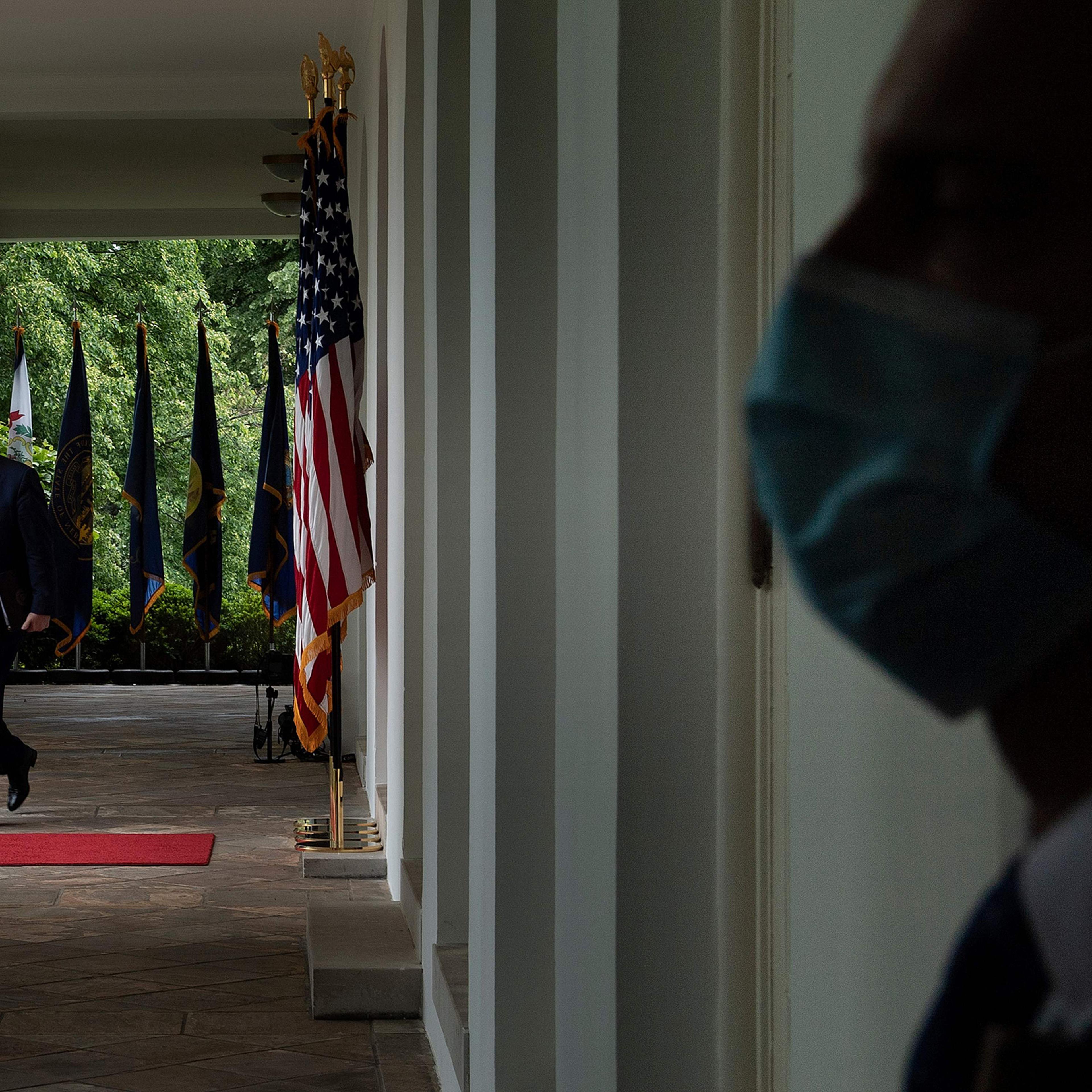 President Trump arrives at a news conference in the Rose Garden on May 11 wearing no mask, despite CDC guidelines advising Americans to use them
