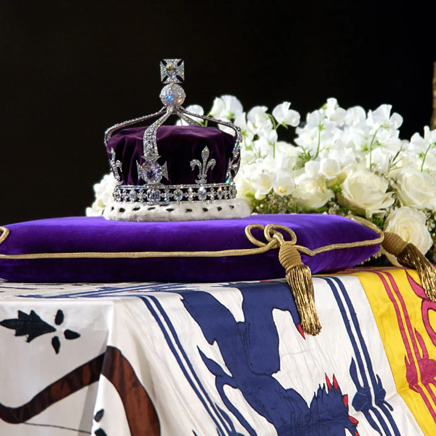 A close-up of the Queen Mother's coffin, the wreath of white flowers and the Queen Mother's coronation crown with the priceless Koh-I-Noor diamond.