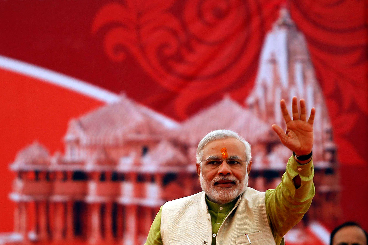 Hindu nationalist Narendra Modi, prime ministerial candidate for India's main opposition Bharatiya Janata Party (BJP) and Gujarat's chief minister, waves to his supporters during a public meeting at Somnath in the western Indian state of Gujarat Feb. 1, 2014