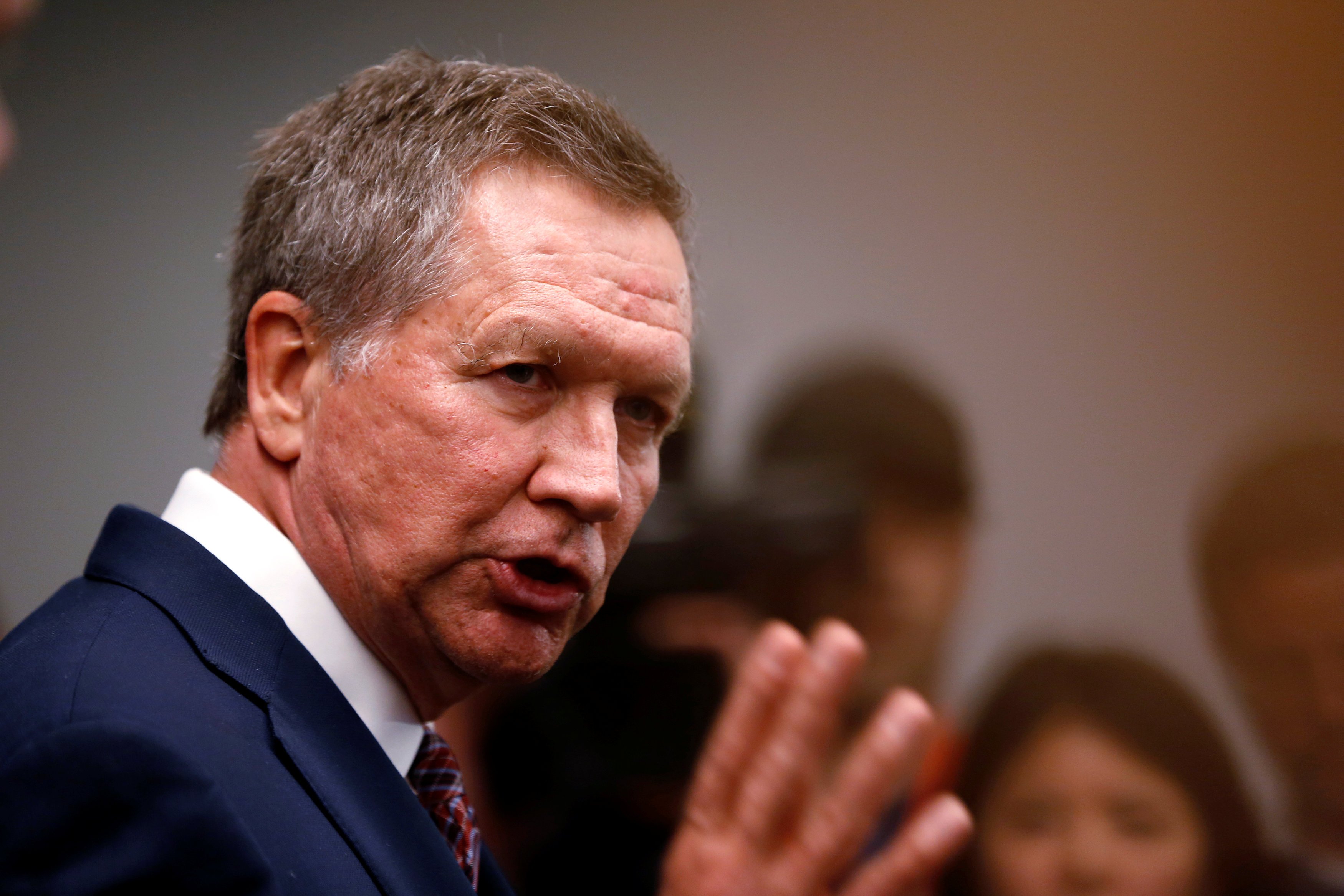 Republican U.S. presidential candidate John Kasich speaks to members of the media before speaking at the California GOP convention in Burlingame, California