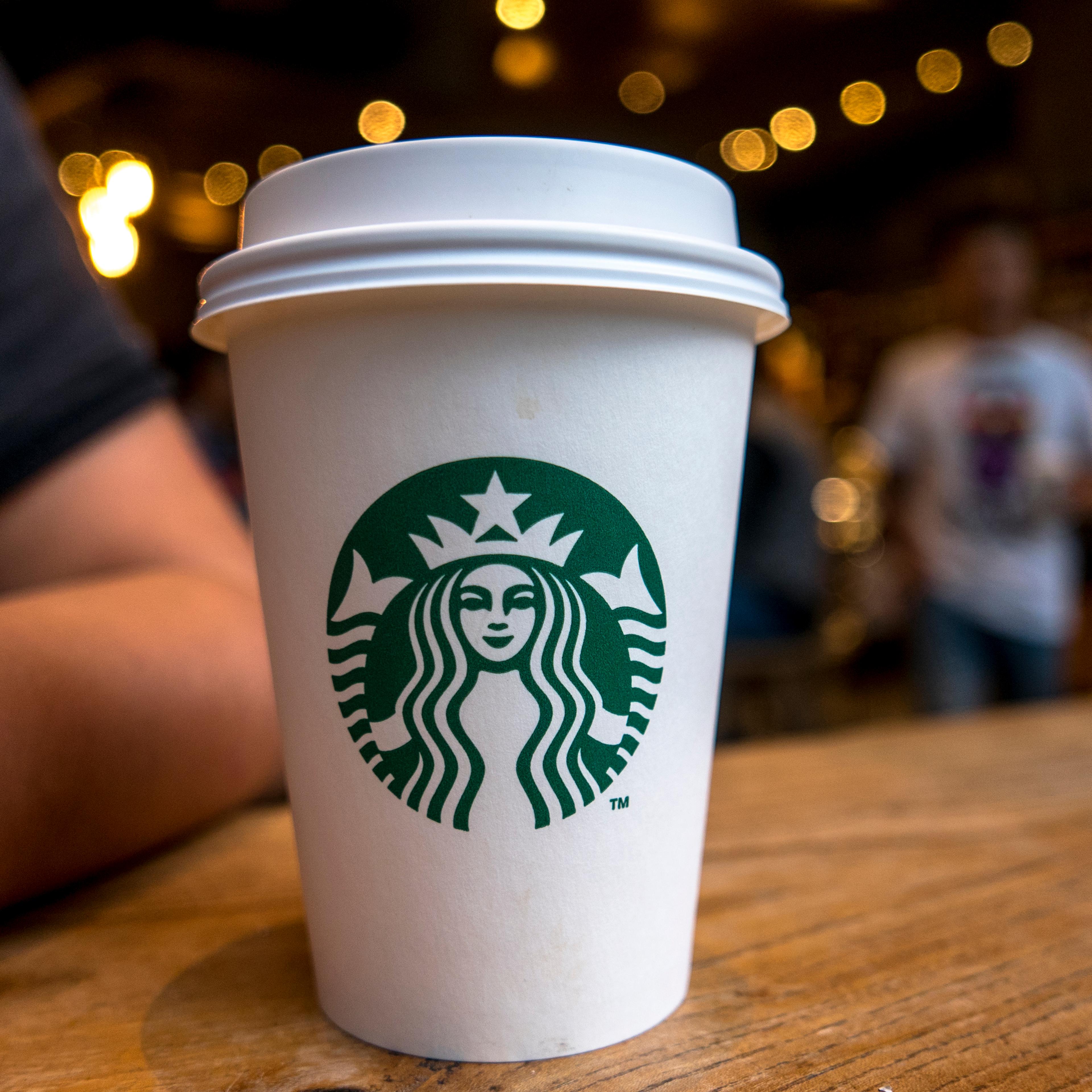 CHENGDU, SICHUAN PROVINCE, CHINA - 2015/09/13: Coffee cup on table in a Starbucks cafe. Starbucks is streamlining the ordering process so customers are able to get that cup of coffee faster than usual. (Photo by Zhang Peng/LightRocket via Getty Images)