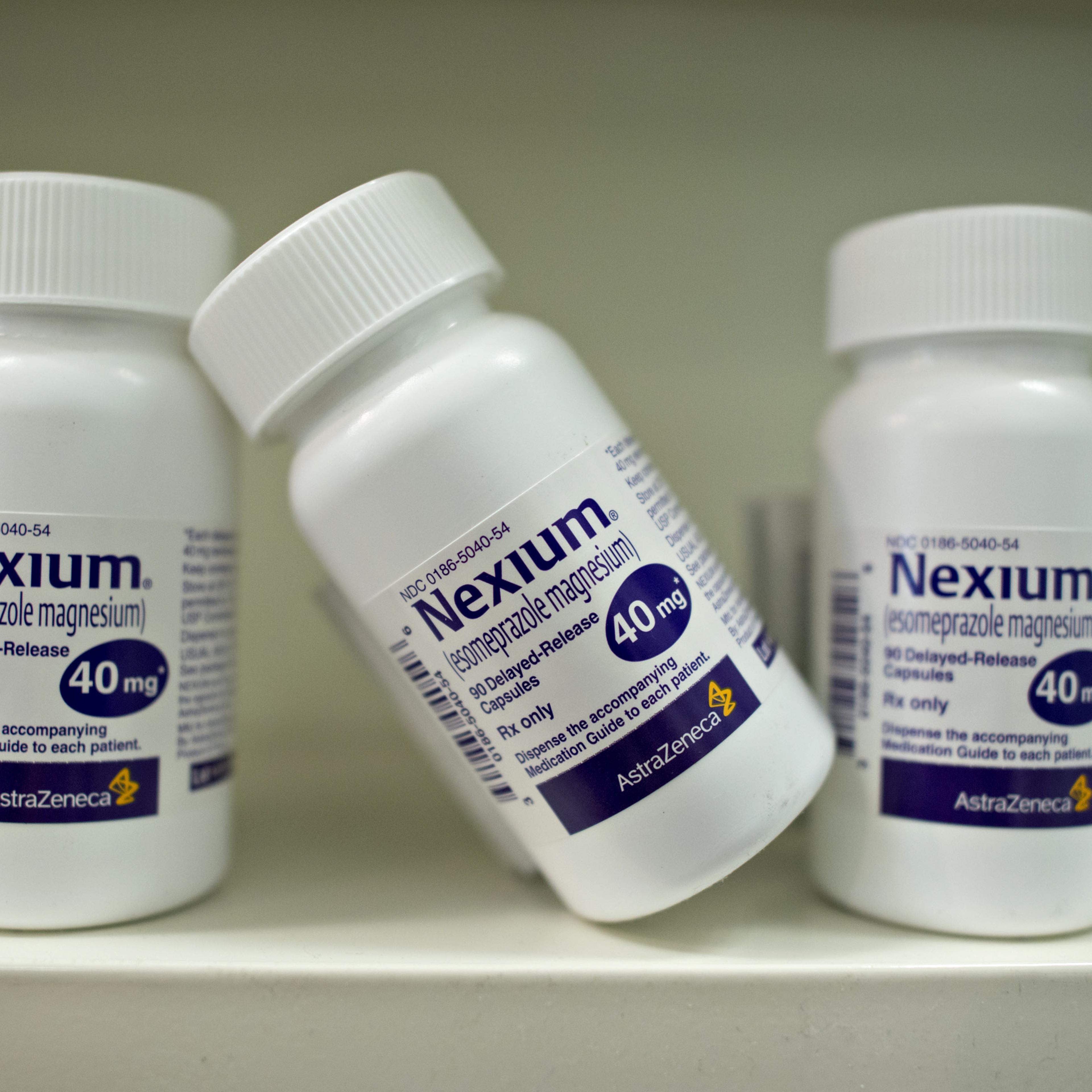 Bottles of AstraZeneca Plc's Nexium heartburn medication are arranged for a photograph at a pharmacy in Princeton, Illinois, U.S., on Wednesday, Aug. 20, 2014.