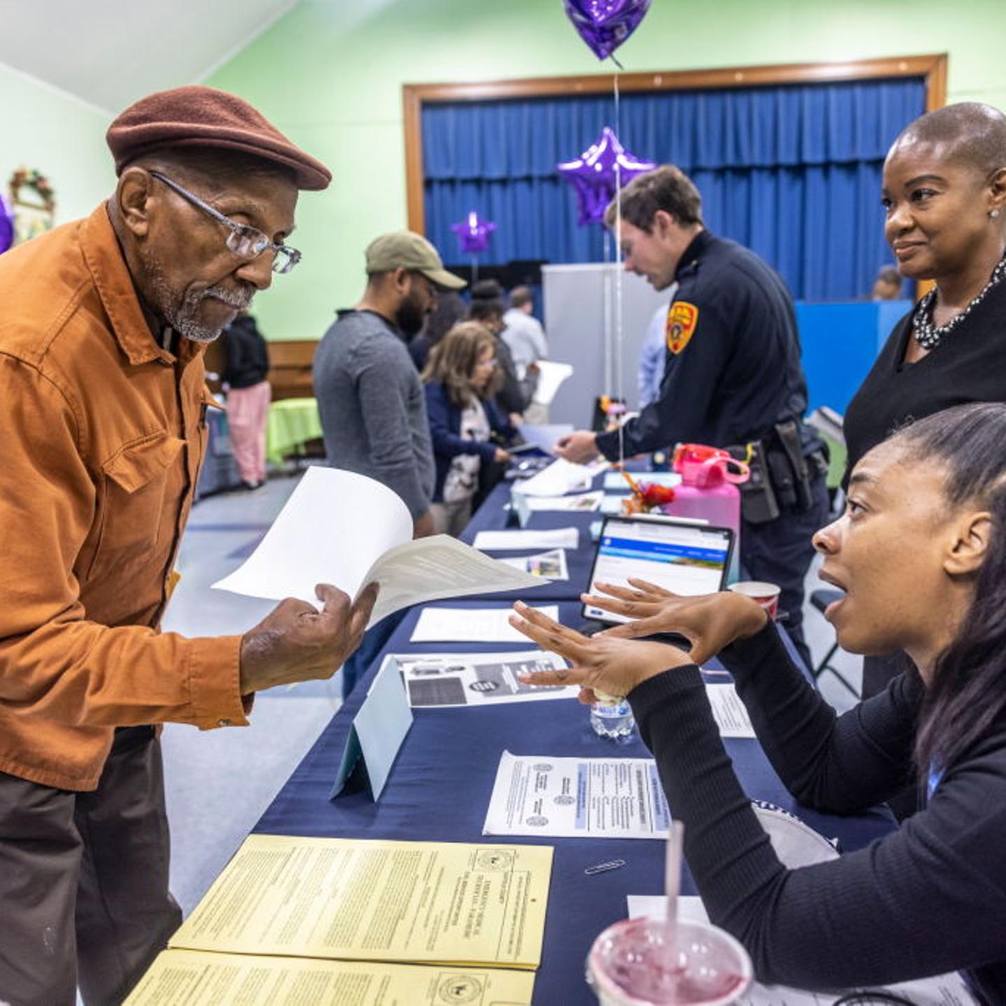 Job seekers meet with potential employers at Long Island job fair
