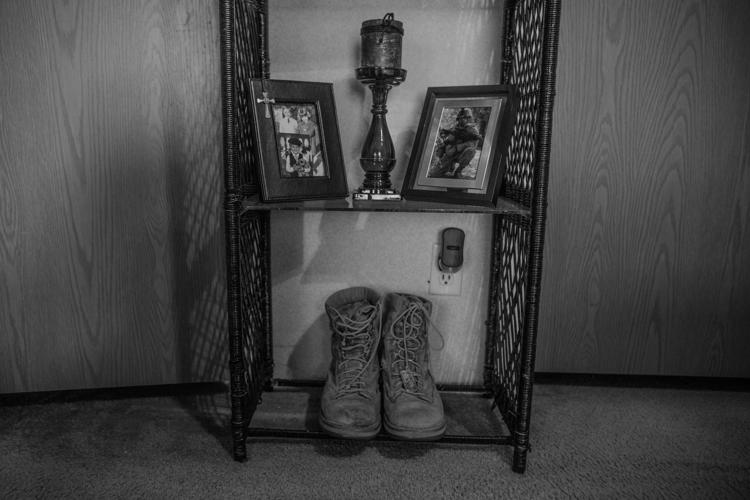 Brandon Ladner. Pelham, Alabama.Brandon Ladner's Marine Corps boots sit on a small shelf in his bedroom. Brandon was a U.S. Marine Corps Veteran. He fought in Afghanistan's Helmand Province.Brandon, suffering from PTSD shot himself inside his living room