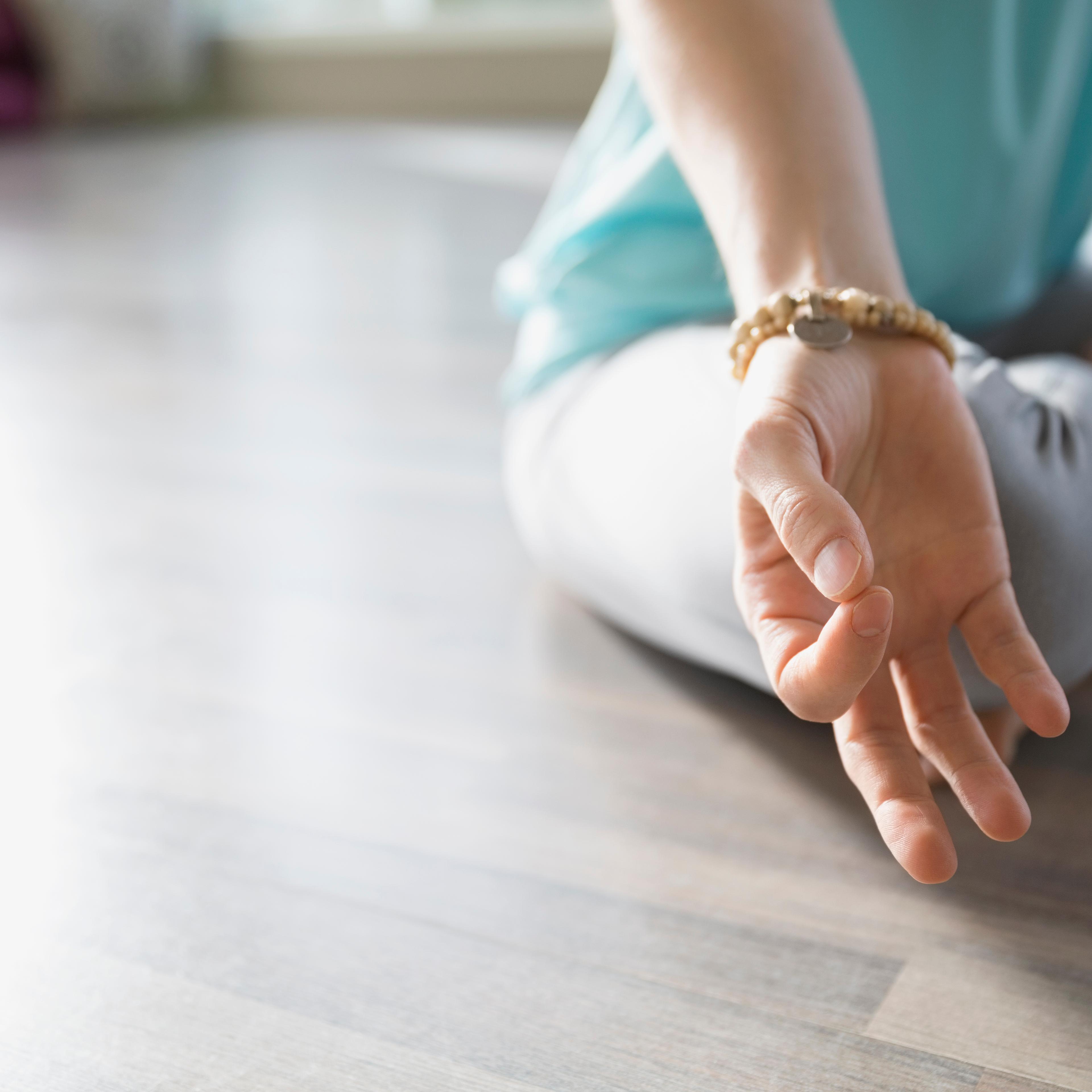 Close up of woman practicing mudra meditation