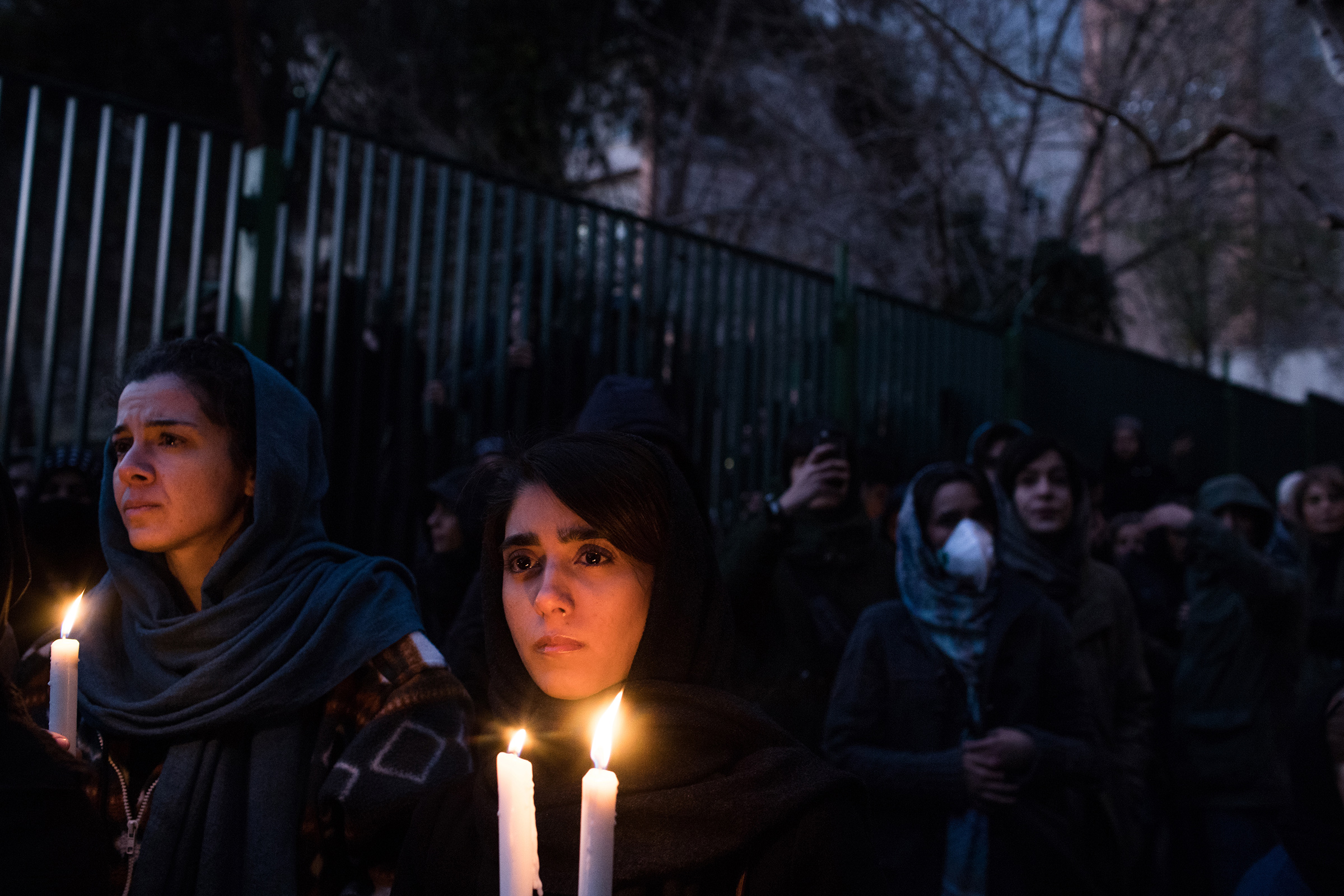 Demonstrators at a vigil in Tehran on Jan. 11 mourn victims of a plane crash caused by Iran’s military