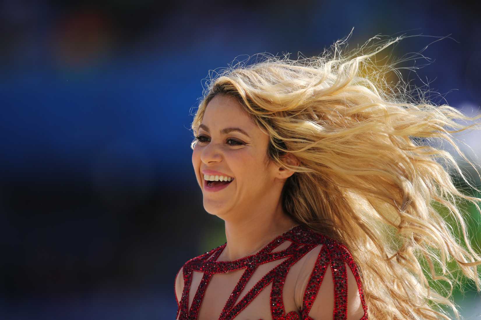 Colombian singer Shakira smiles during the closing ceremony of the 2014 Fifa World Cup, before the final match between Germany and Argentina, at Maracana Stadium, in Rio de Janeiro, southeastern Brazil, on July 13, 2014.