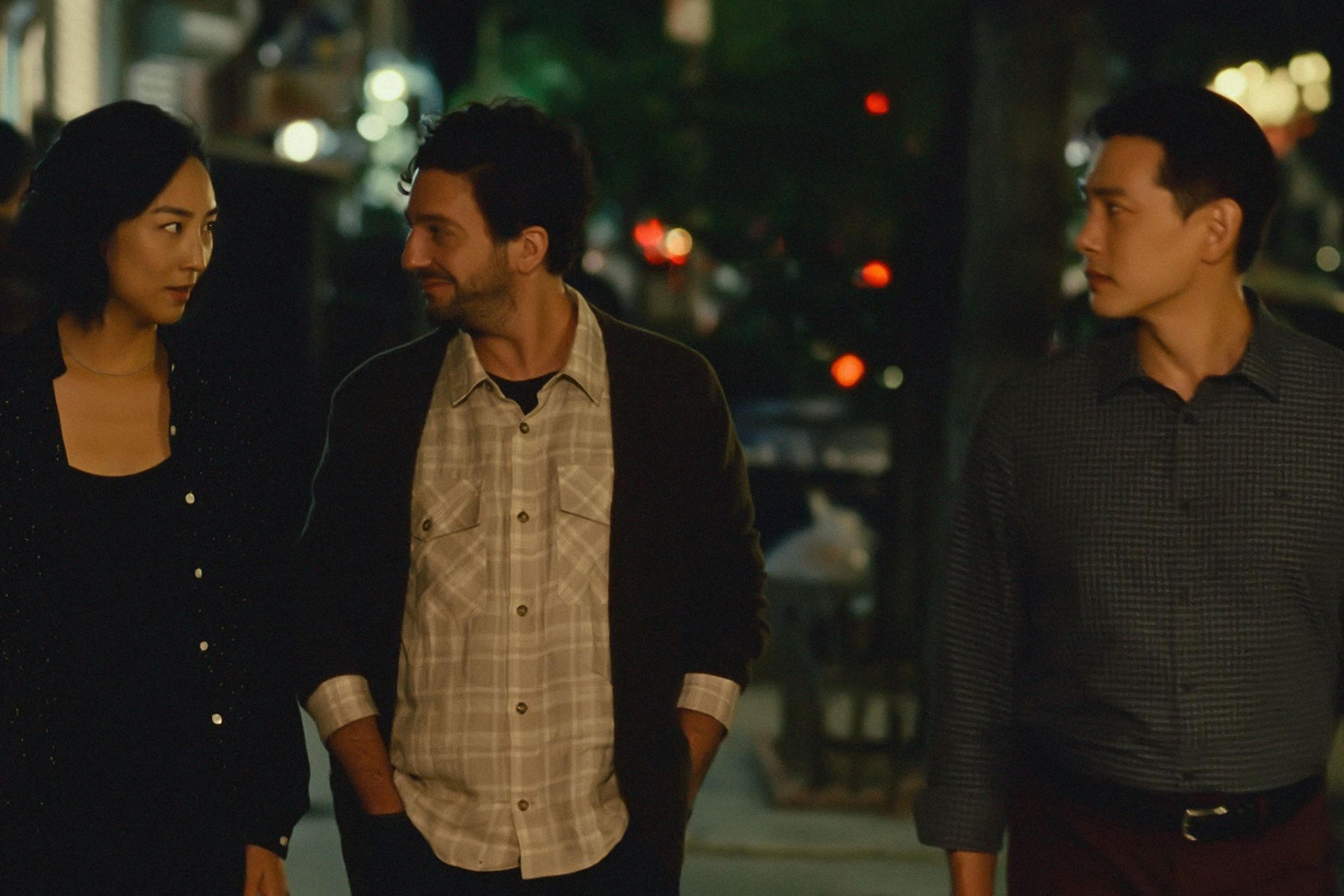 Nora (Greta Lee), Arthur (John Magaro), and Hae Sung (Teo Yoo) stroll through the East Village.