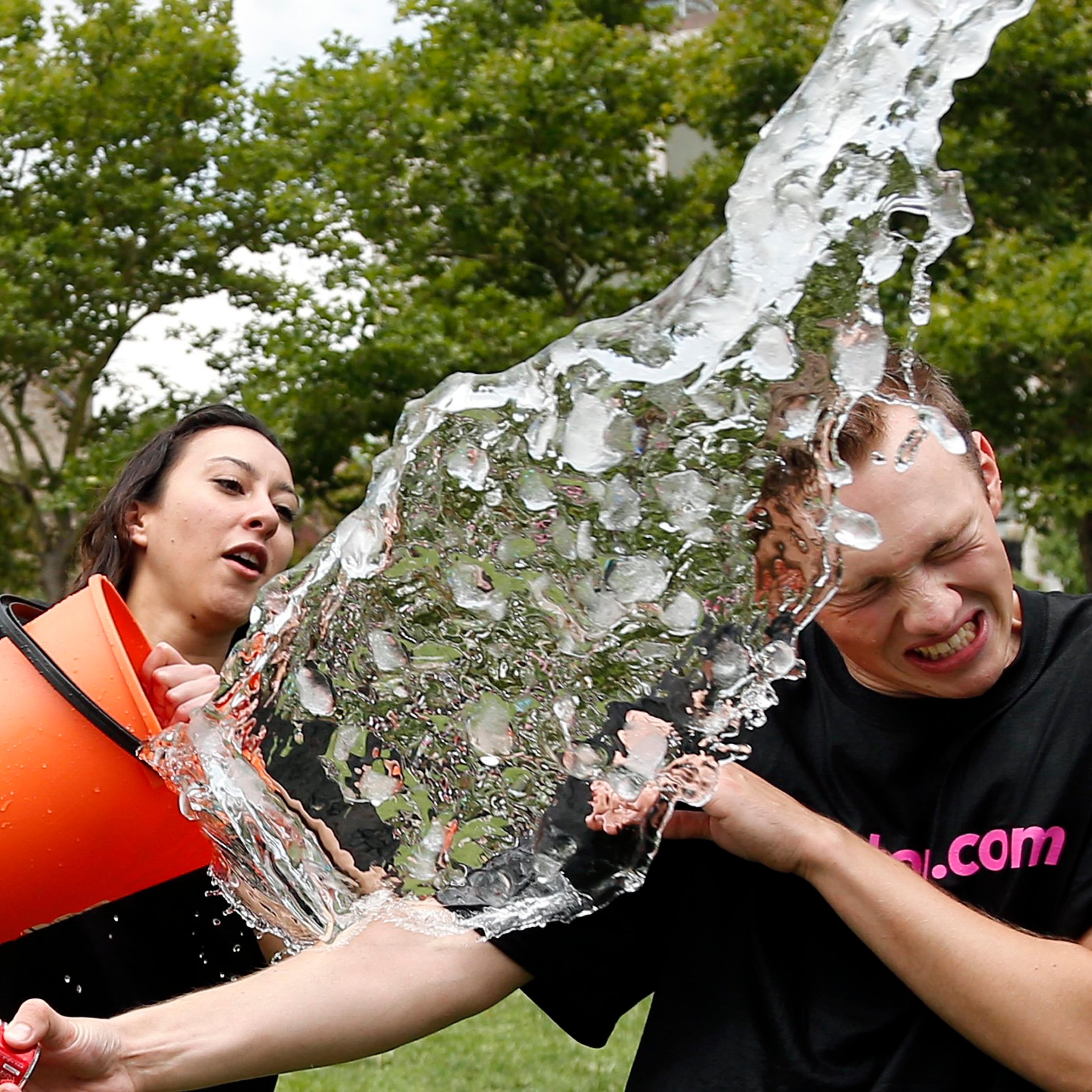 Beryl Lipton douses Matt Lee during the ice bucket challenge at Boston's Copley Square on August 7, 2014 to raise funds and awareness for ALS.